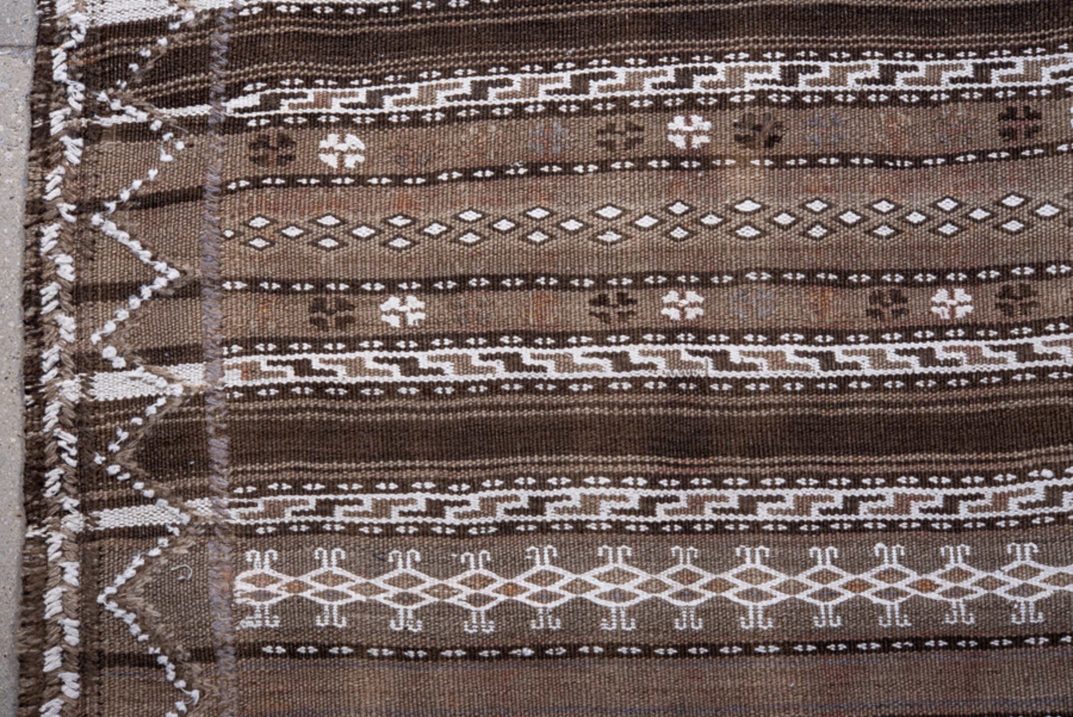 4' x 9' one-of-a-kind handmade vintage Kilim runner rug. Color palette: taupe, ivory, dark_brown, brown, beige, gray