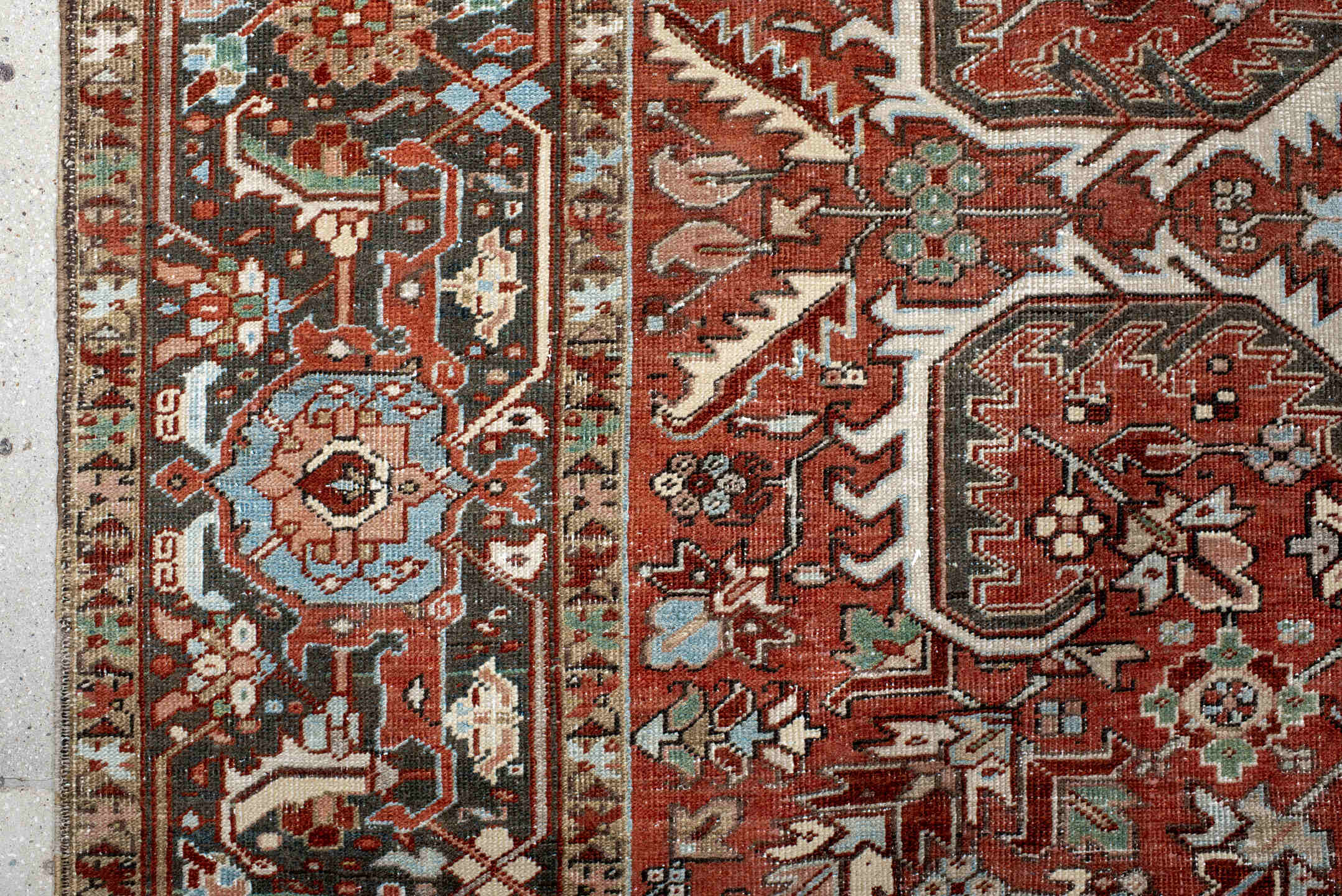 7' x 10' one-of-a-kind handmade antique Heriz large size rug. Color palette: rust, charcoal, ivory, sky_blue, sage, taupe