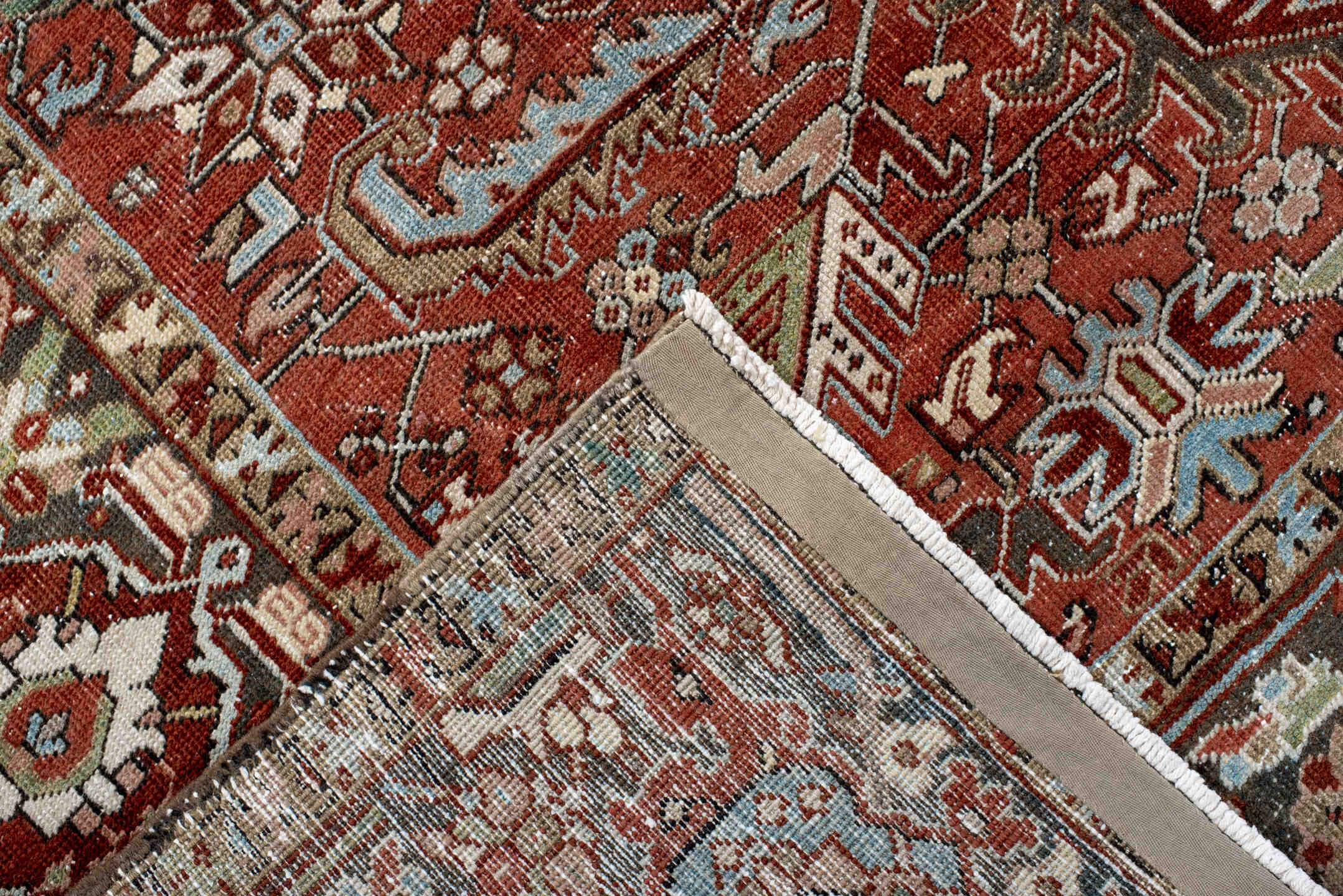 7' x 10' one-of-a-kind handmade antique Heriz large size rug. Color palette: rust, charcoal, ivory, sky_blue, sage, taupe