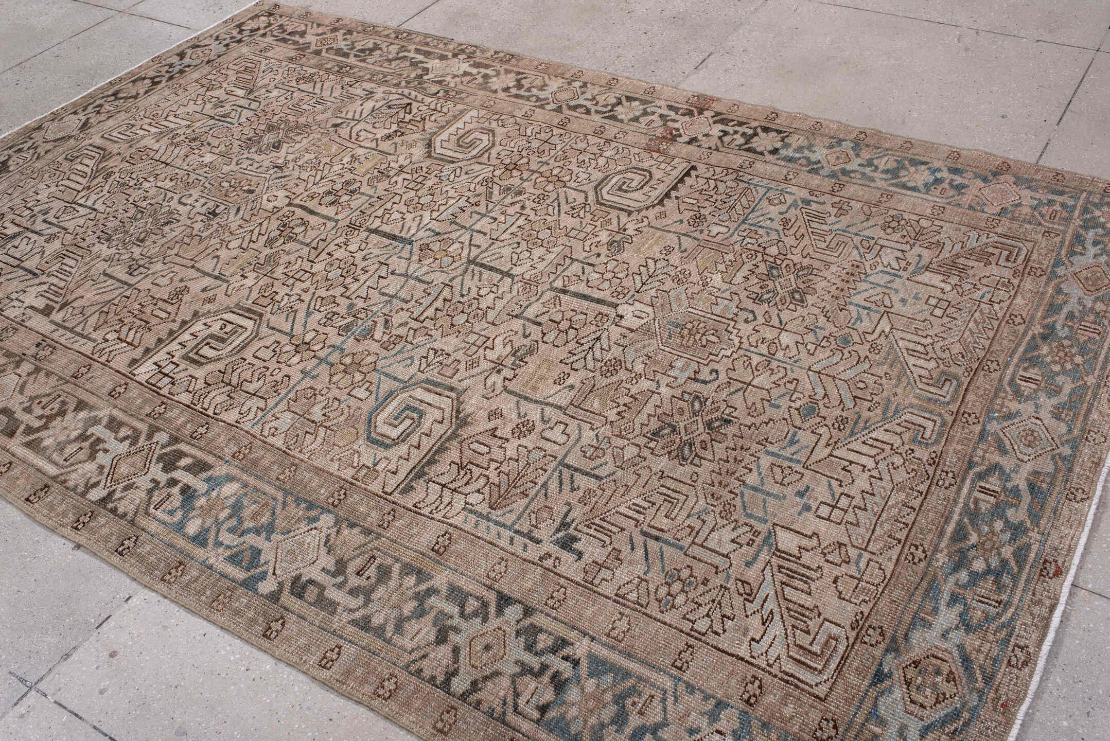 6' x 9' one-of-a-kind handmade antique Heriz medium size rug. Color palette: ivory, taupe, slate, charcoal, camel