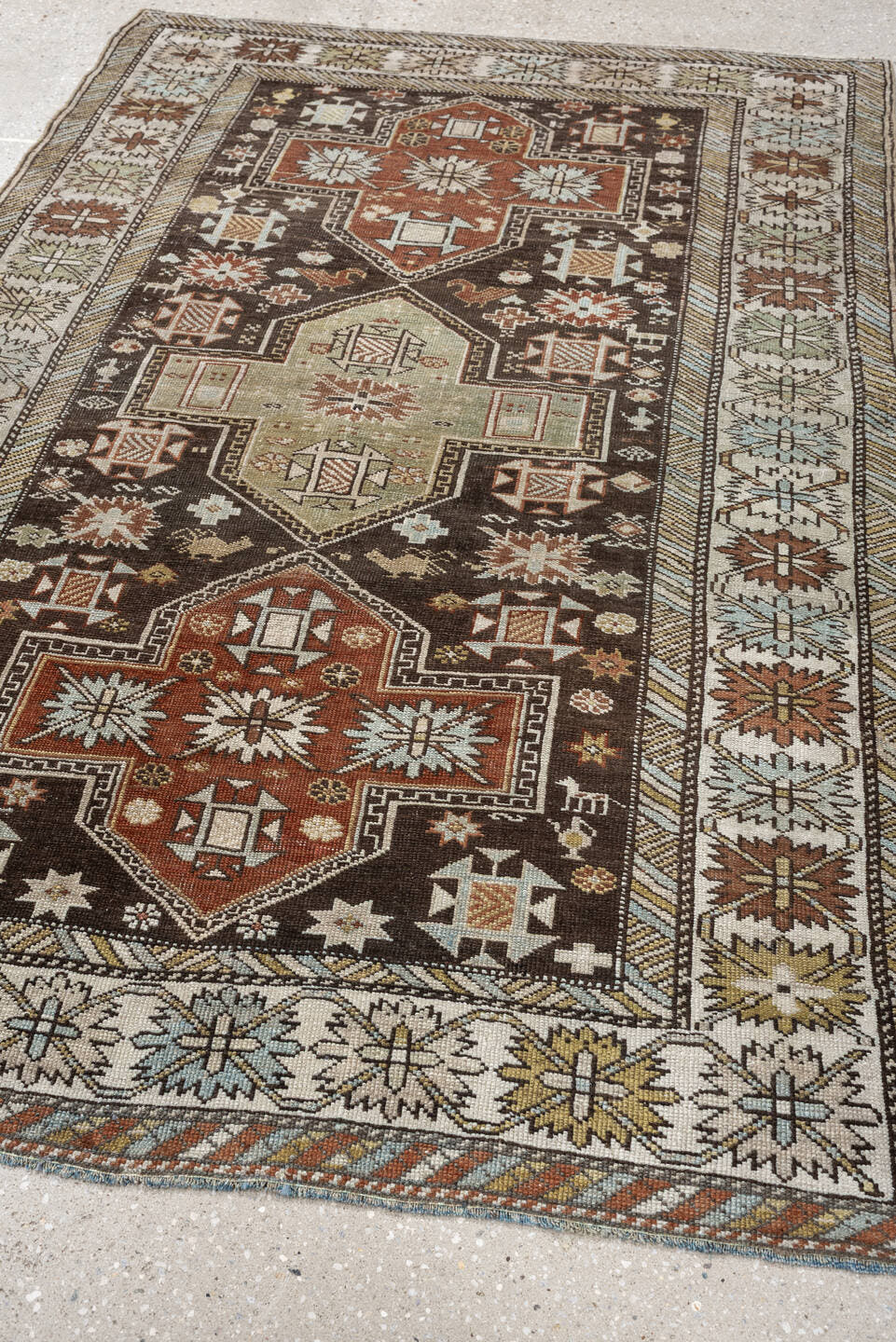 3' x 5' one-of-a-kind handmade antique Shirvan small size rug. Color palette: ivory, dark brown, rust, pale sage, sky blue