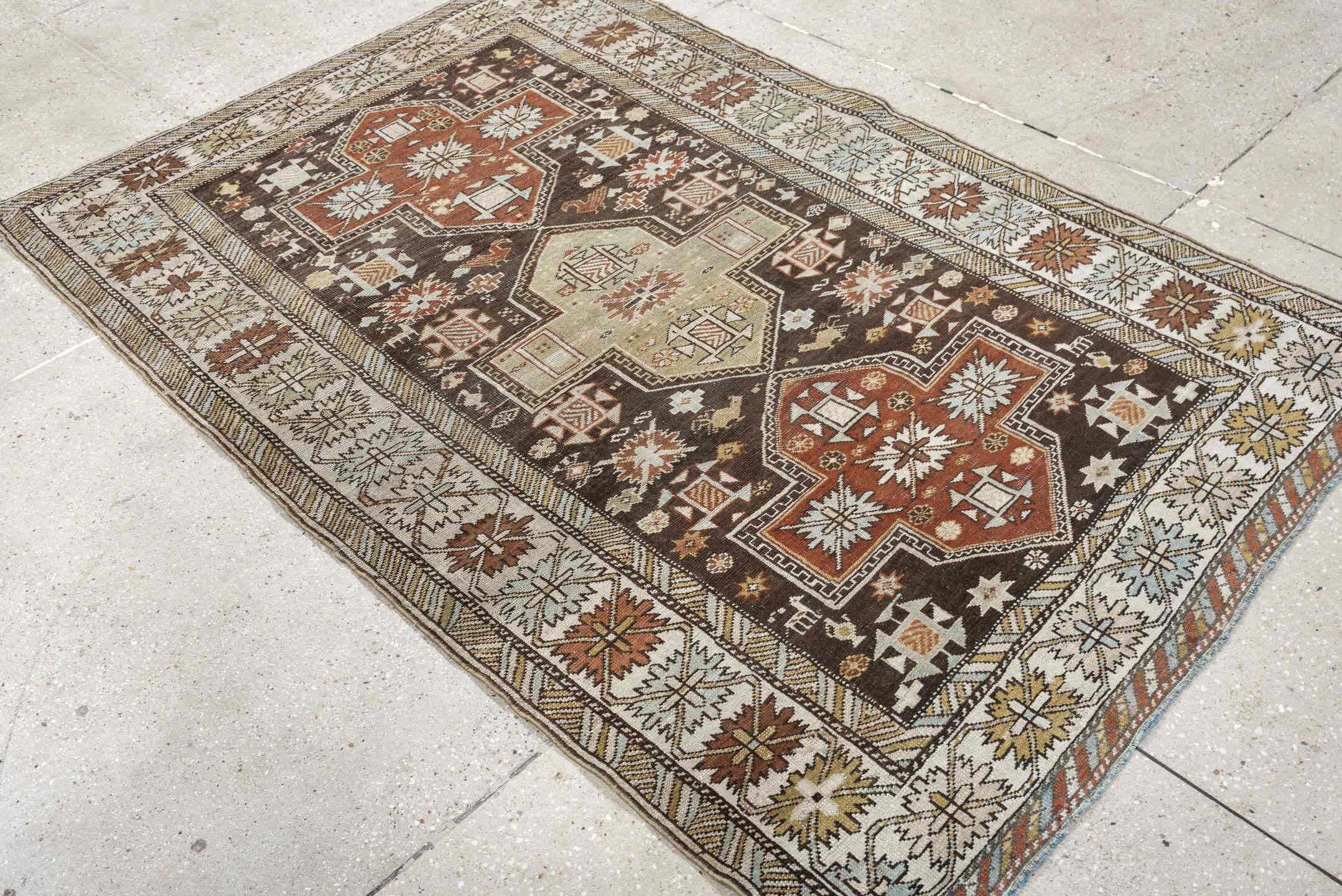 3' x 5' one-of-a-kind handmade antique Shirvan small size rug. Color palette: ivory, dark brown, rust, pale sage, sky blue