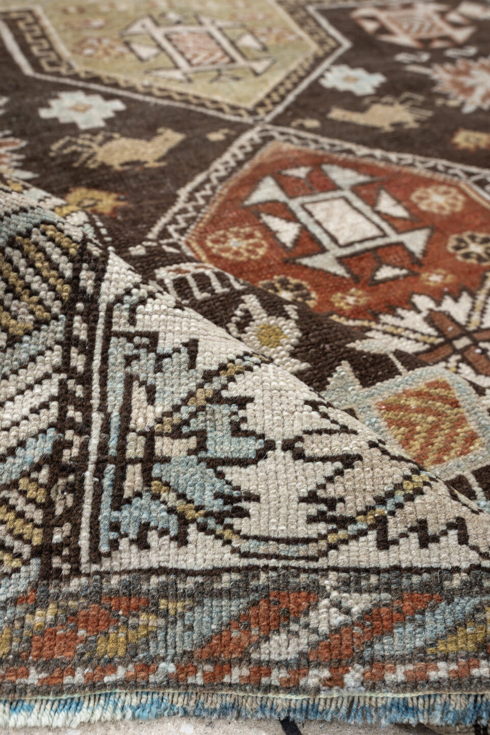 3' x 5' one-of-a-kind handmade antique Shirvan small size rug. Color palette: ivory, dark brown, rust, pale sage, sky blue