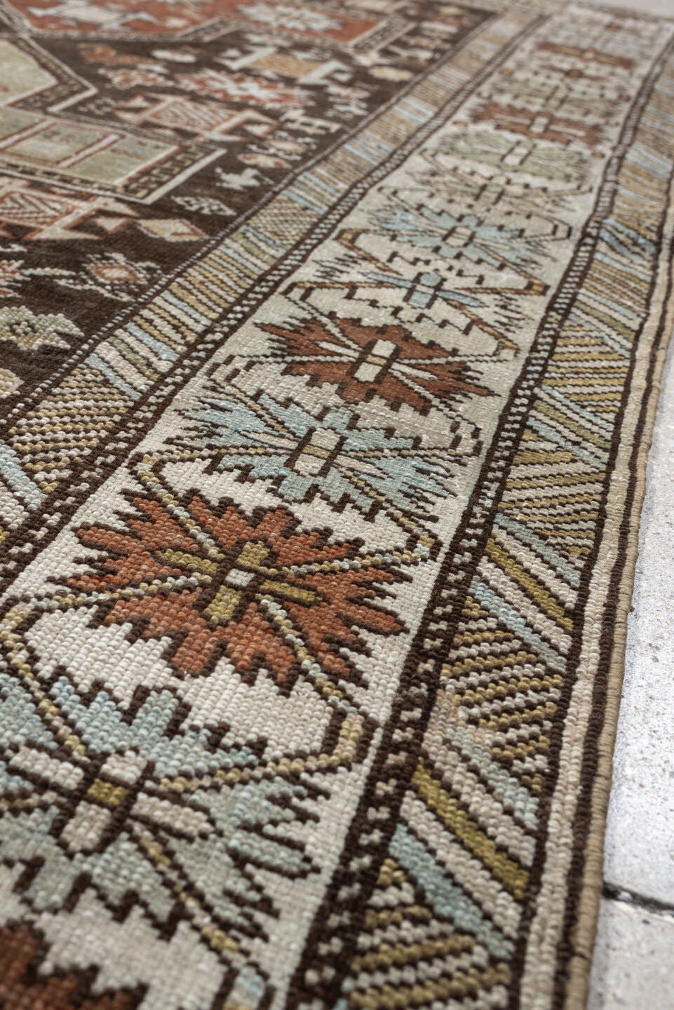 3' x 5' one-of-a-kind handmade antique Shirvan small size rug. Color palette: ivory, dark brown, rust, pale sage, sky blue