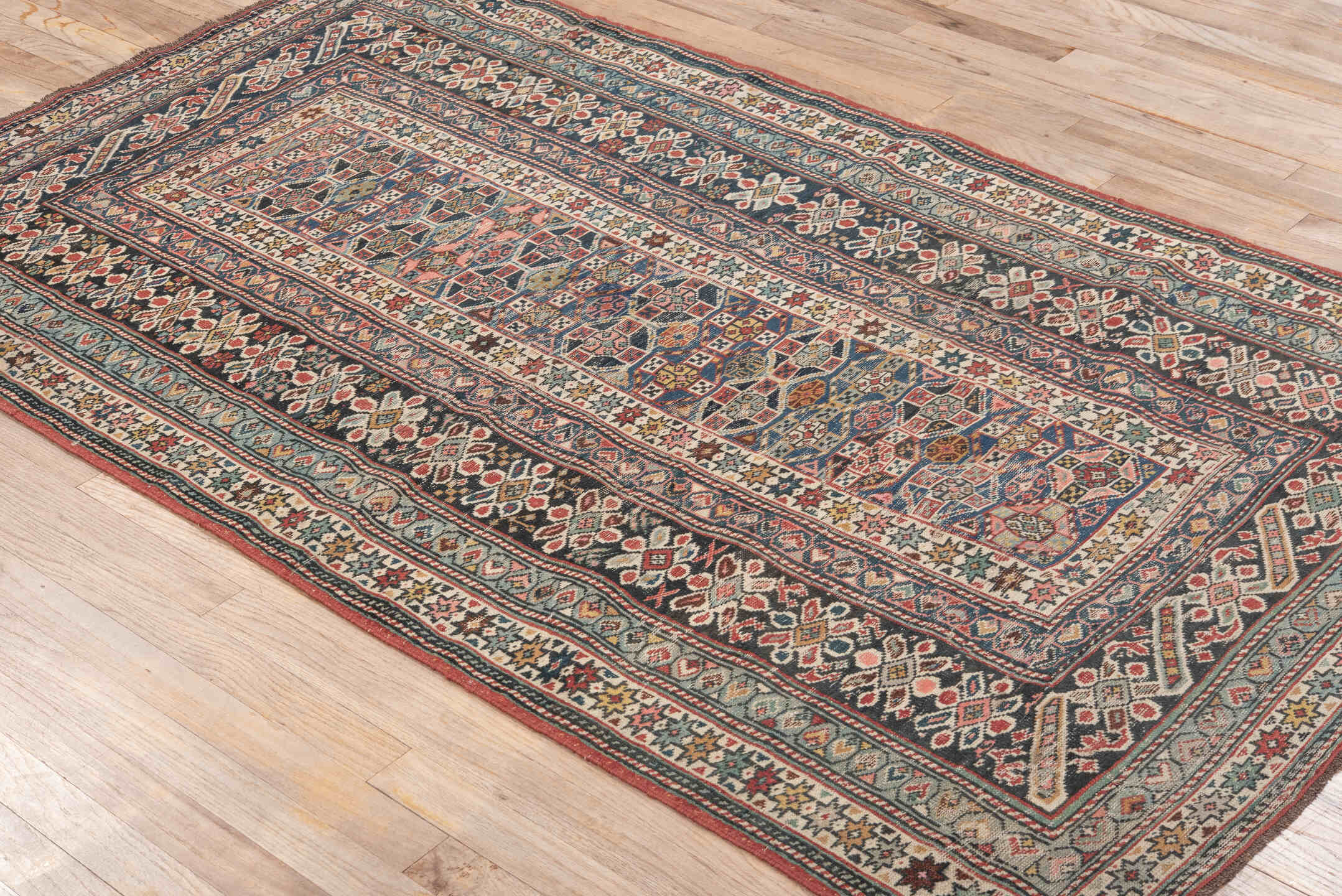 3' x 6' one-of-a-kind handmade antique Chichi small size rug. Color palette: ivory, indigo, rust, sky blue, navy, crimson