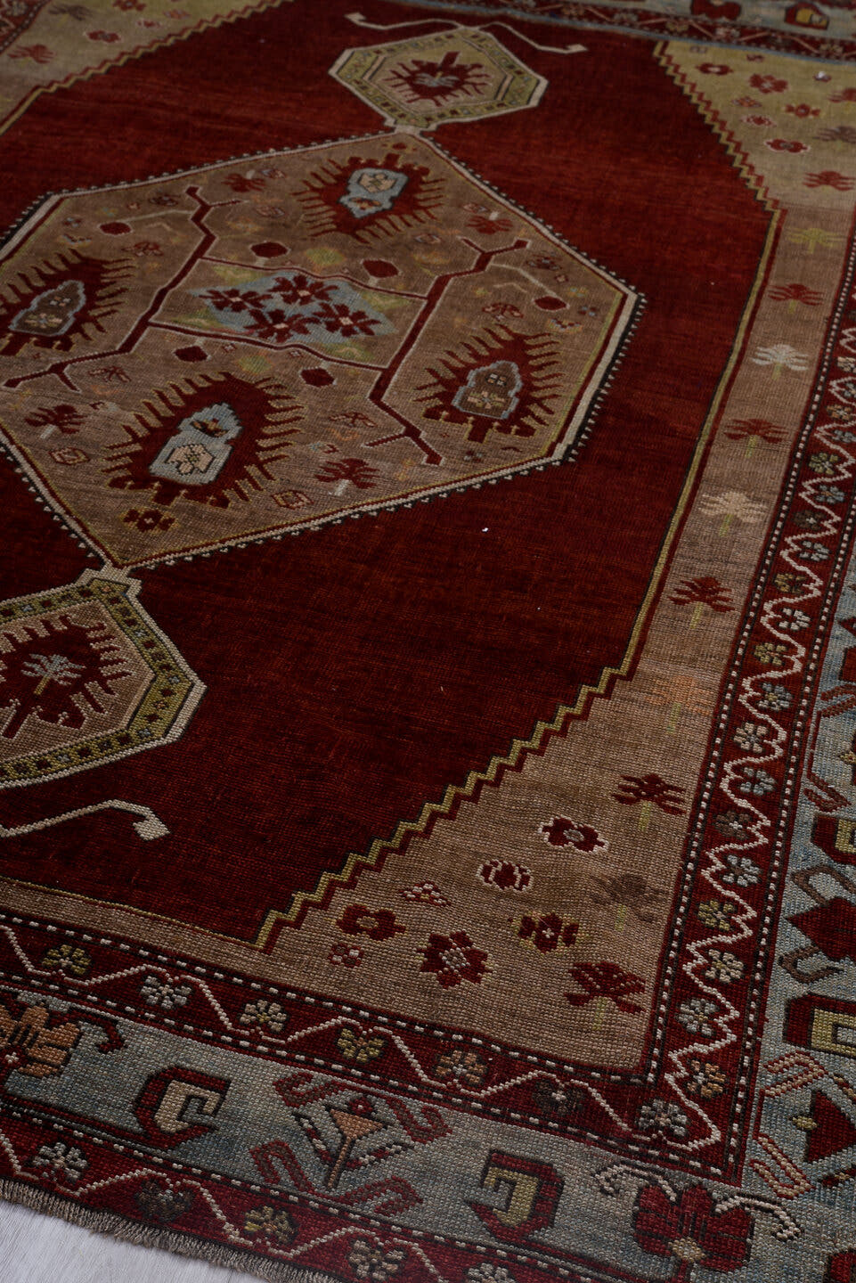 5' x 7' one-of-a-kind handmade antique Kazak rug. Color palette: red, ivory, sky blue, burgundy, taupe, brown, light blue