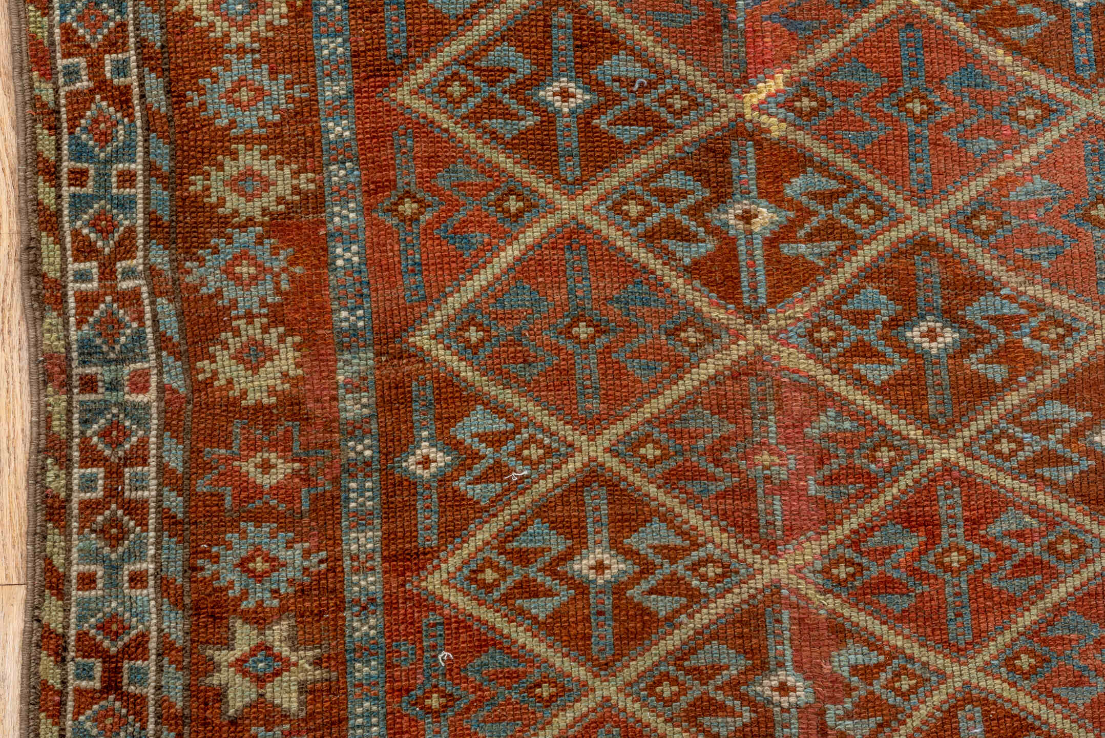 4' x 8' one-of-a-kind handmade antique Kurd rug. Color palette: rust, camel, ivory, sky blue, brown, taupe, gold, terracotta