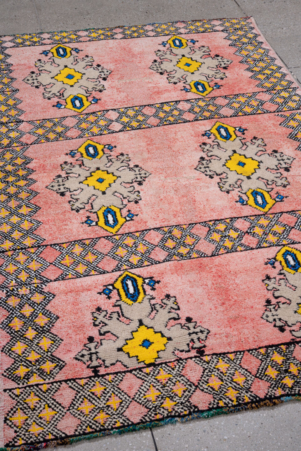 4' x 6' one-of-a-kind handmade vintage Moroccan small size rug. Color palette: pink, yellow, charcoal, taupe, blue, ivory