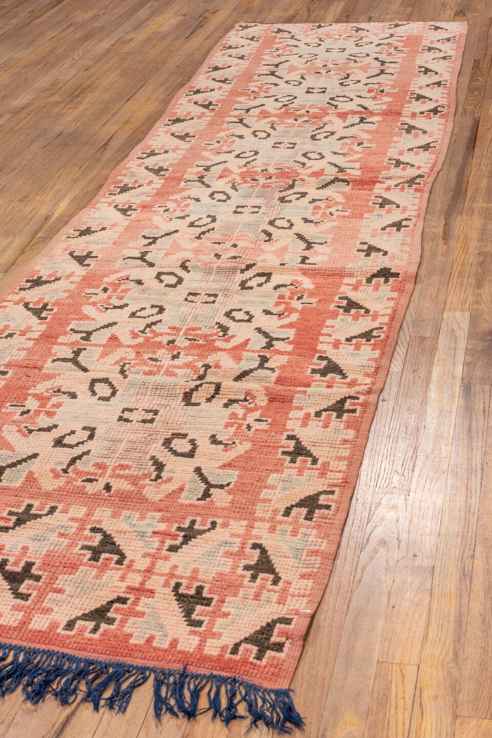 3' x 11' one-of-a-kind handmade vintage Moroccan runner rug. Color palette: blue, brown, gray, off-white, orange, pink, red