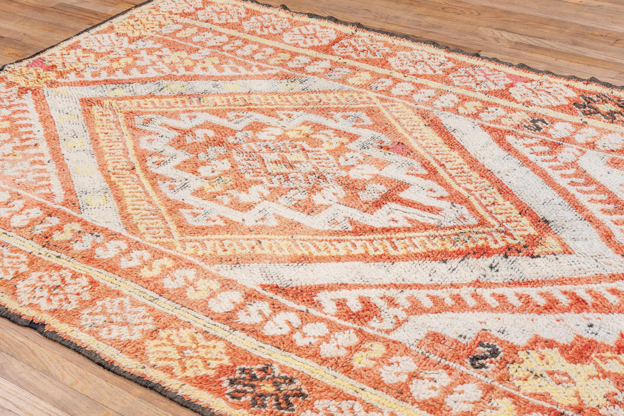 5' x 9' one-of-a-kind handmade vintage Moroccan medium size rug. Color palette: terra cotta, ivory, rust, gold, charcoal