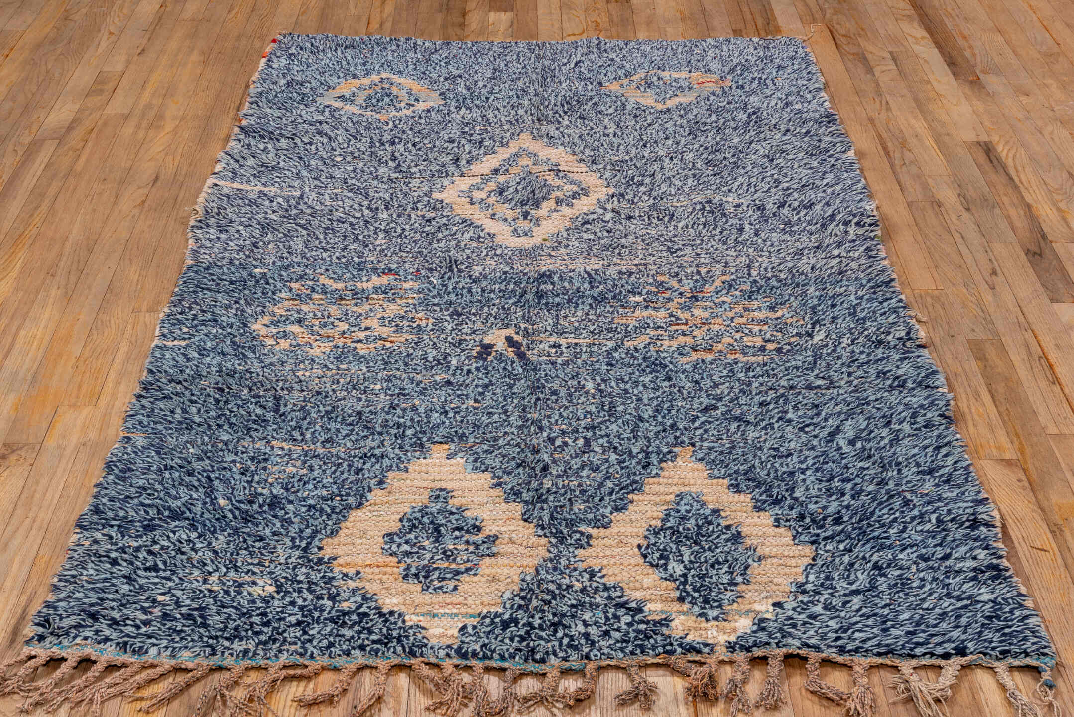4' x 7' one-of-a-kind handmade vintage Moroccan rug. Color palette: indigo, ivory, navy, charcoal, rose, purple, blue, gray