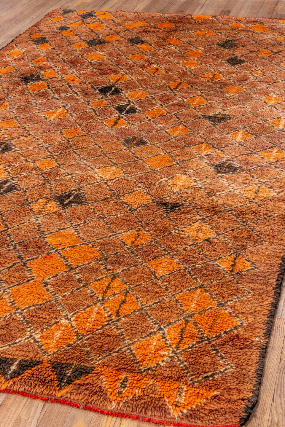 6' x 10' one-of-a-kind handmade antique Moroccan large size rug. Color palette: terra cotta, orange, brown, camel, charcoal