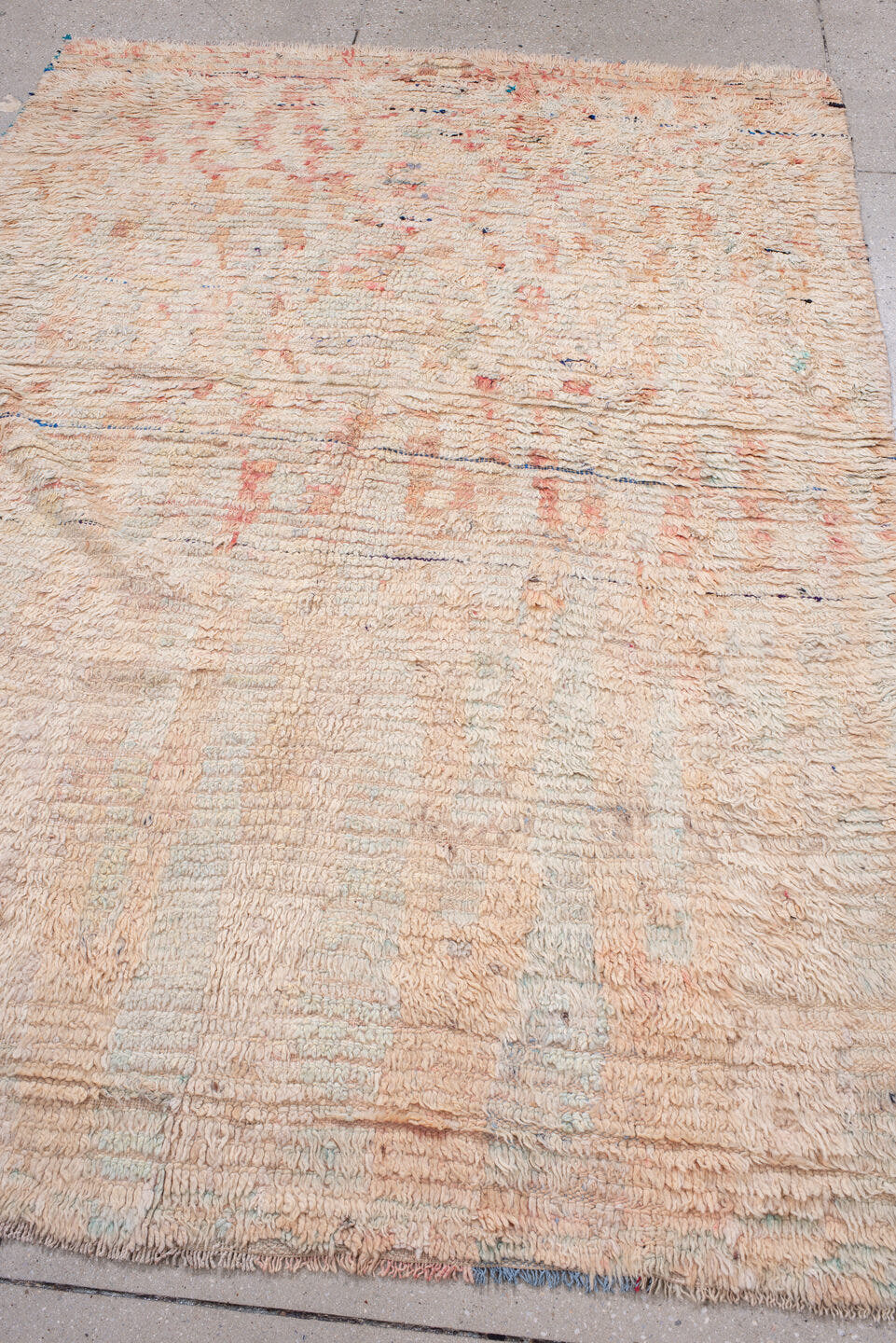 5' x 7' one-of-a-kind handmade antique Moroccan rug. Color palette: ivory, blush, peach, pale blue, cream, charcoal, pink