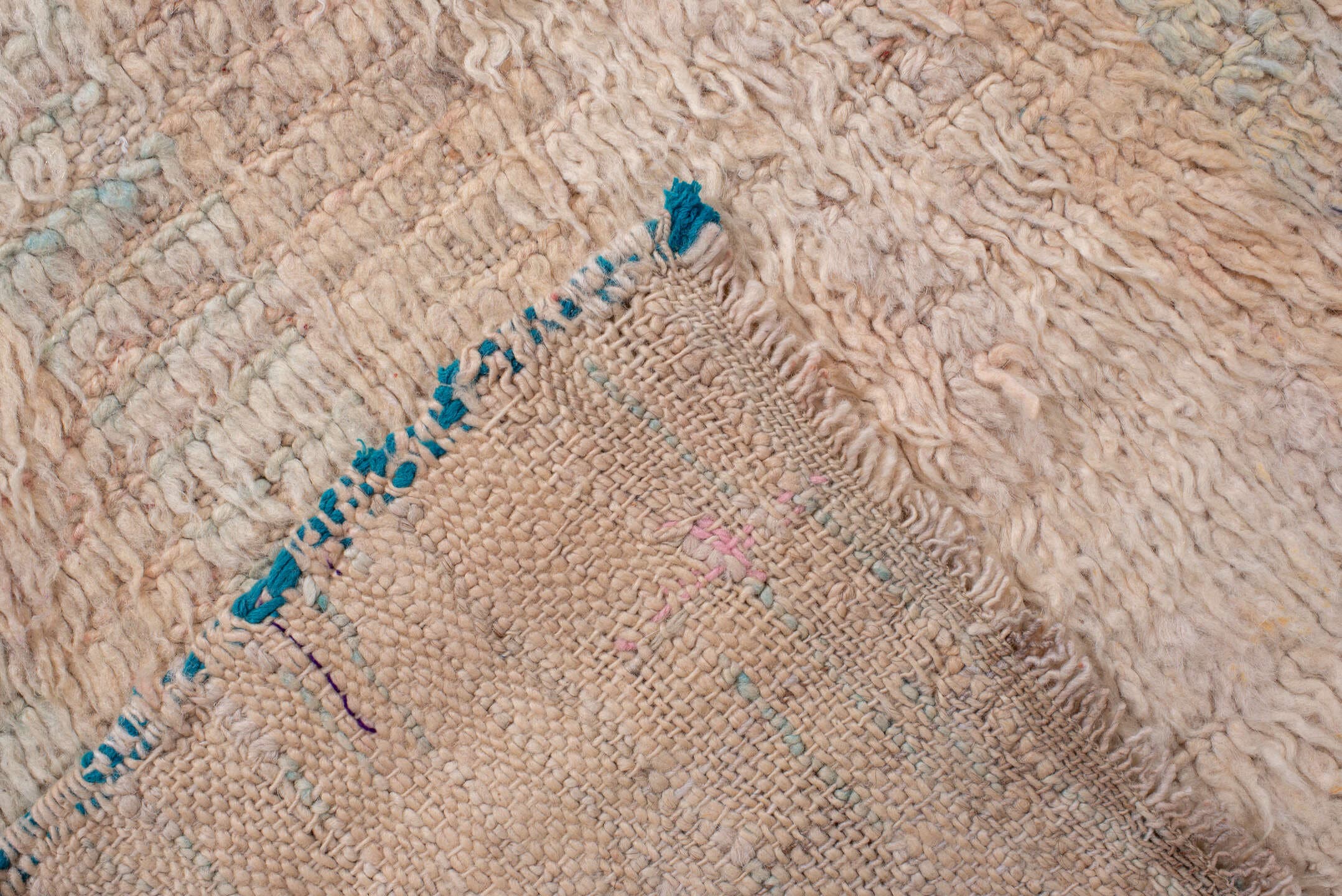 5' x 7' one-of-a-kind handmade antique Moroccan rug. Color palette: ivory, blush, peach, pale blue, cream, charcoal, pink