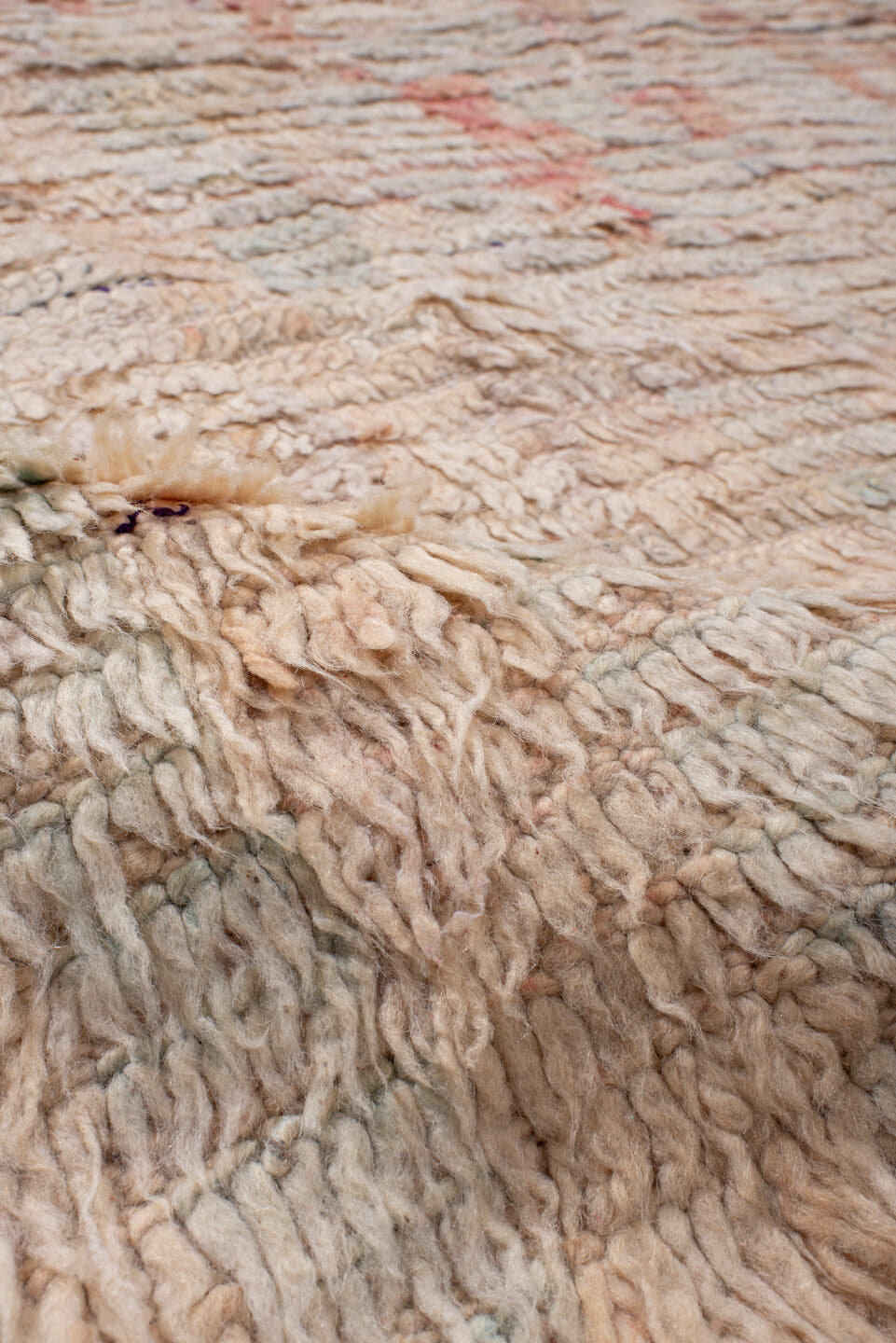 5' x 7' one-of-a-kind handmade antique Moroccan rug. Color palette: ivory, blush, peach, pale blue, cream, charcoal, pink
