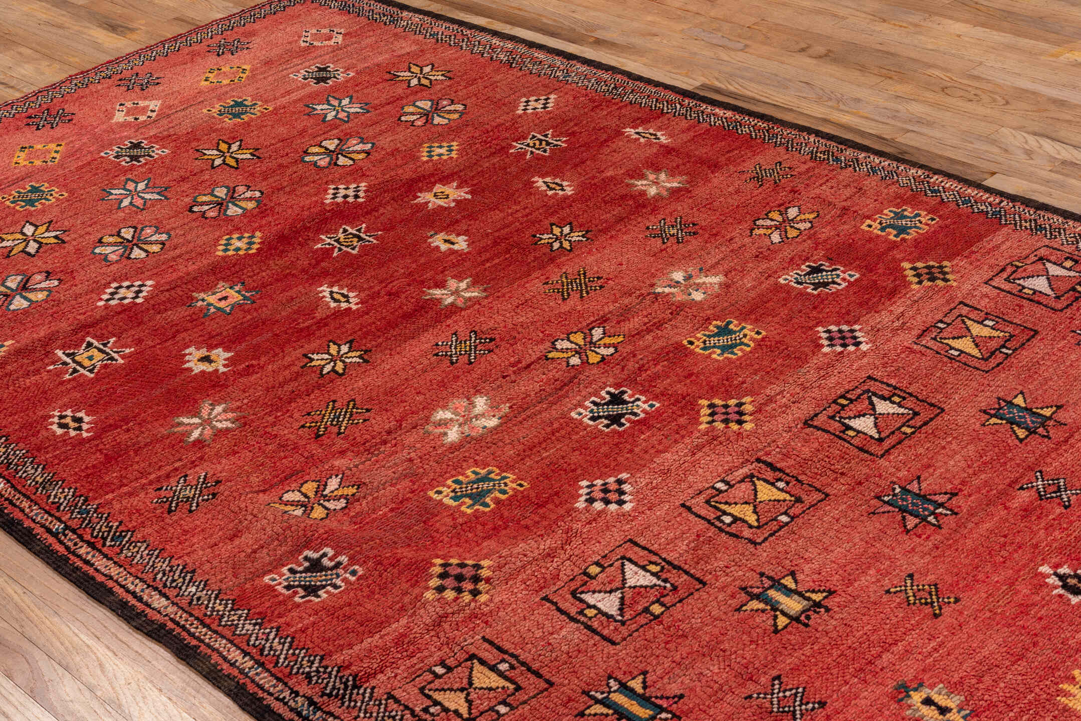 5' x 10' one-of-a-kind handmade antique Moroccan medium size rug. Color palette: terra cotta, rust, charcoal, ivory, gold