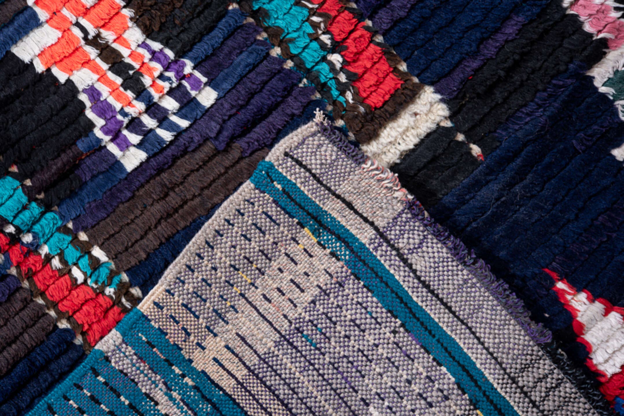 3' x 7' one-of-a-kind handmade vintage Moroccan runner rug. Color palette: navy, black, turquoise, coral, ivory, violet