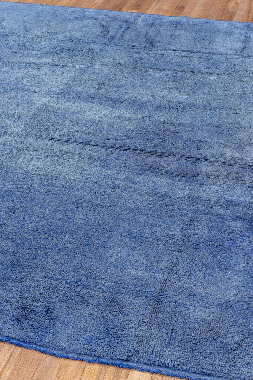 7' x 9' one-of-a-kind handmade antique Moroccan rug. Color palette: blue, cobalt, indigo, purple