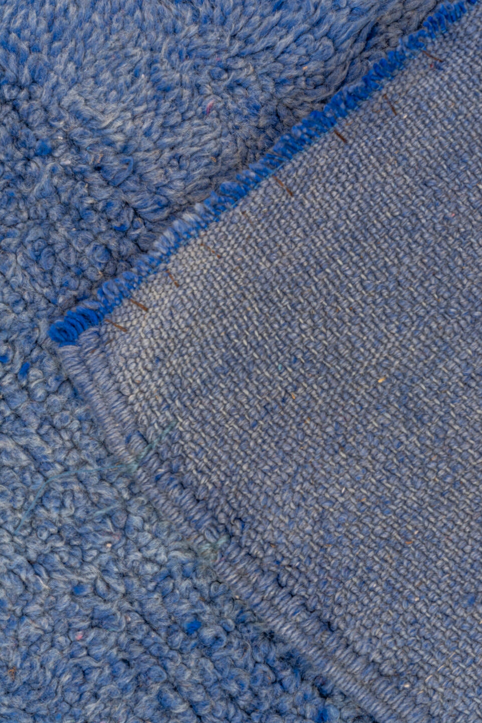 7' x 9' one-of-a-kind handmade antique Moroccan rug. Color palette: blue, cobalt, indigo, purple