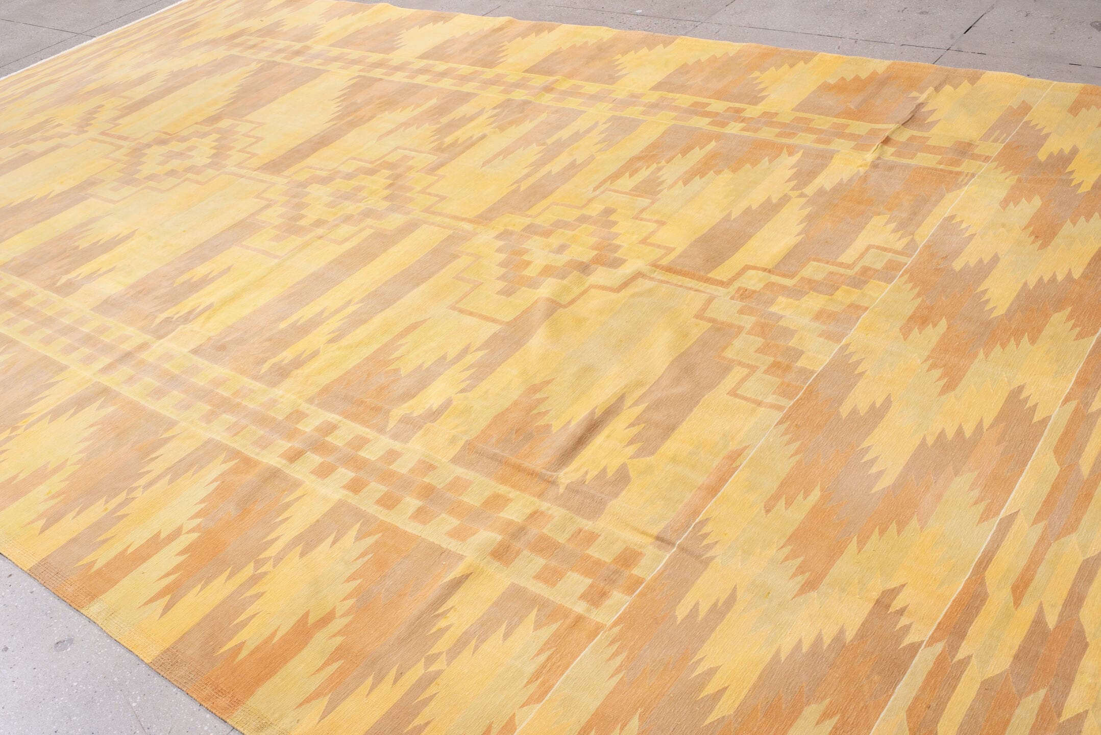 9' x 16' one-of-a-kind handmade antique Dhurrie rug. Color palette: gold, butter yellow, peach, terra cotta, camel