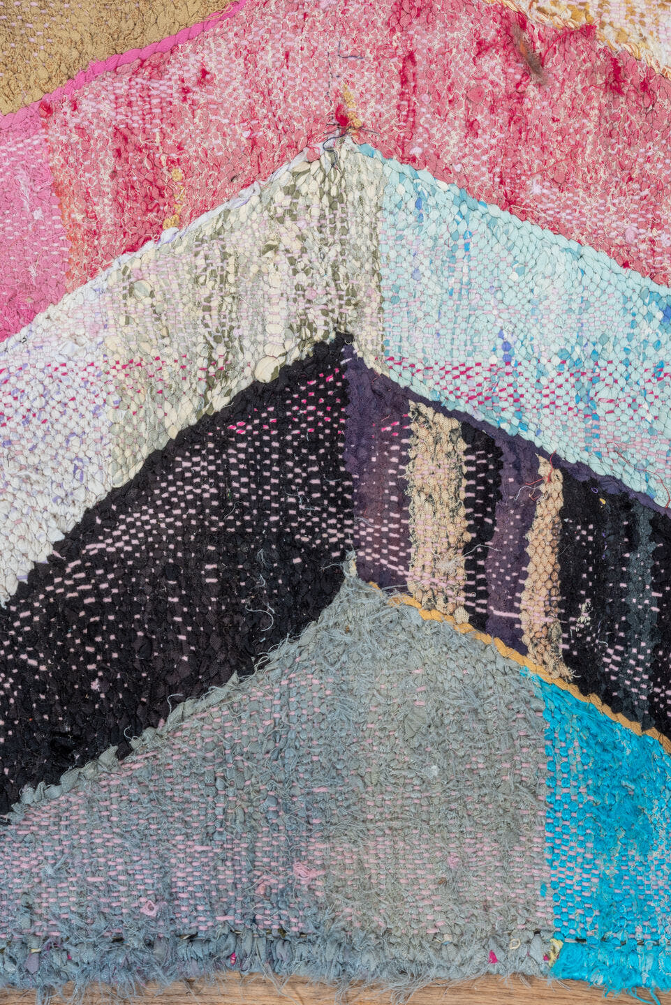 4' x 8' one-of-a-kind handmade vintage Rag Rug rug. Color palette: ivory, pink, tan, charcoal, sky_blue, taupe, orange