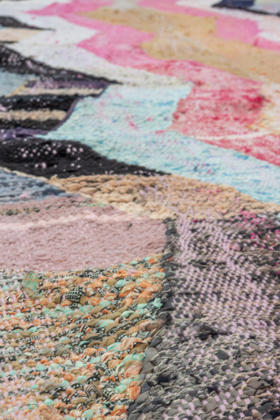 4' x 8' one-of-a-kind handmade vintage Rag Rug rug. Color palette: ivory, pink, tan, charcoal, sky_blue, taupe, orange