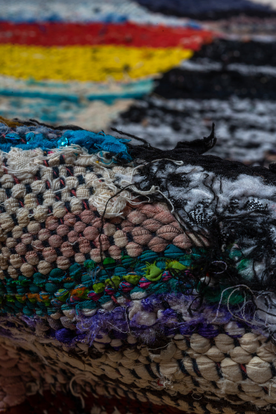 4' x 8' one-of-a-kind handmade vintage Rag Rug runner rug. Color palette: ivory, black, sky_blue, pink, yellow, rust, brown