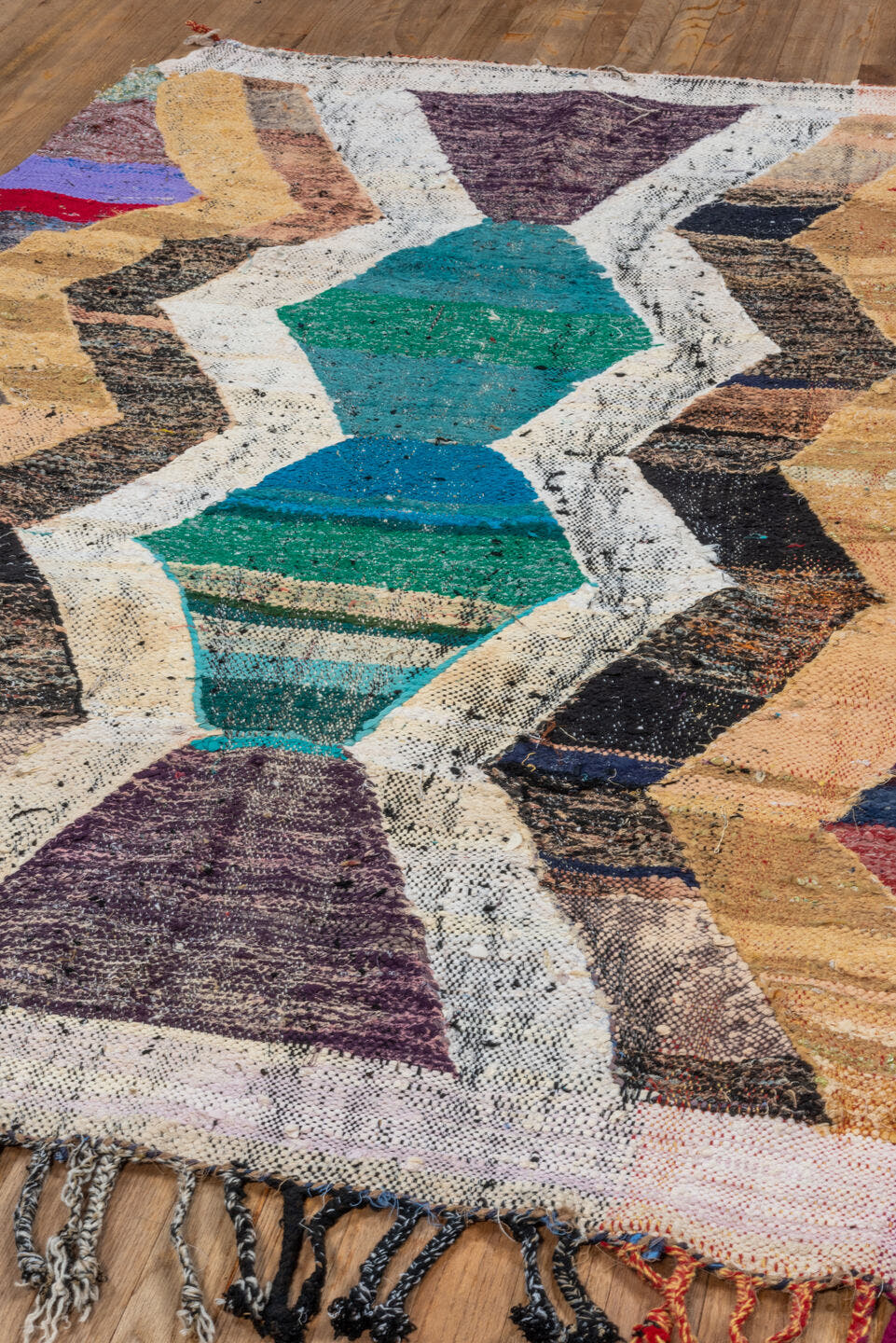 4' x 6' one-of-a-kind handmade vintage Rag Rug small size rug. Color palette: ivory, camel, teal, plum, charcoal, red, taupe