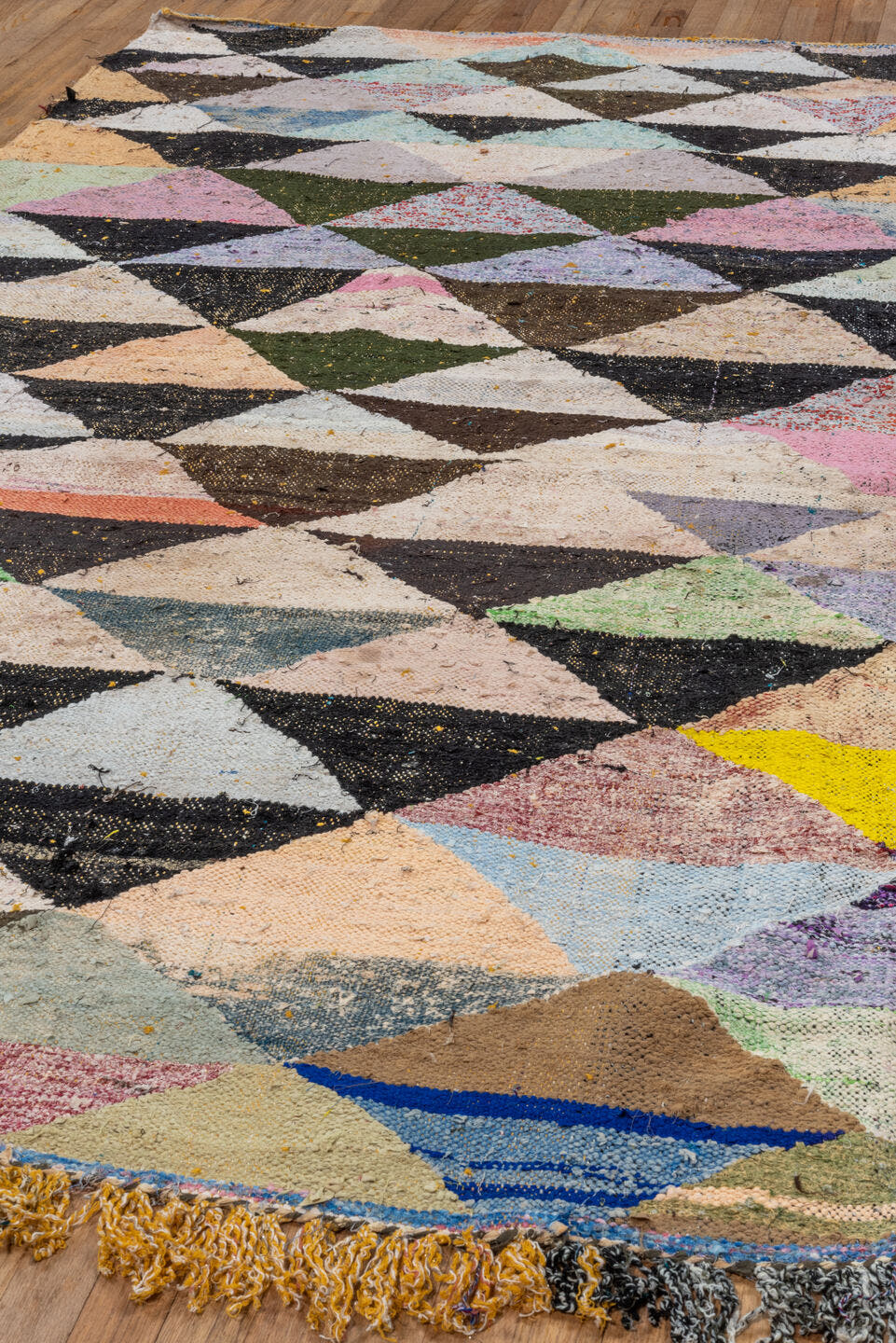5' x 9' one-of-a-kind handmade vintage Rag Rug medium size rug. Color palette: ivory, black, sand, blush, sky blue, mint