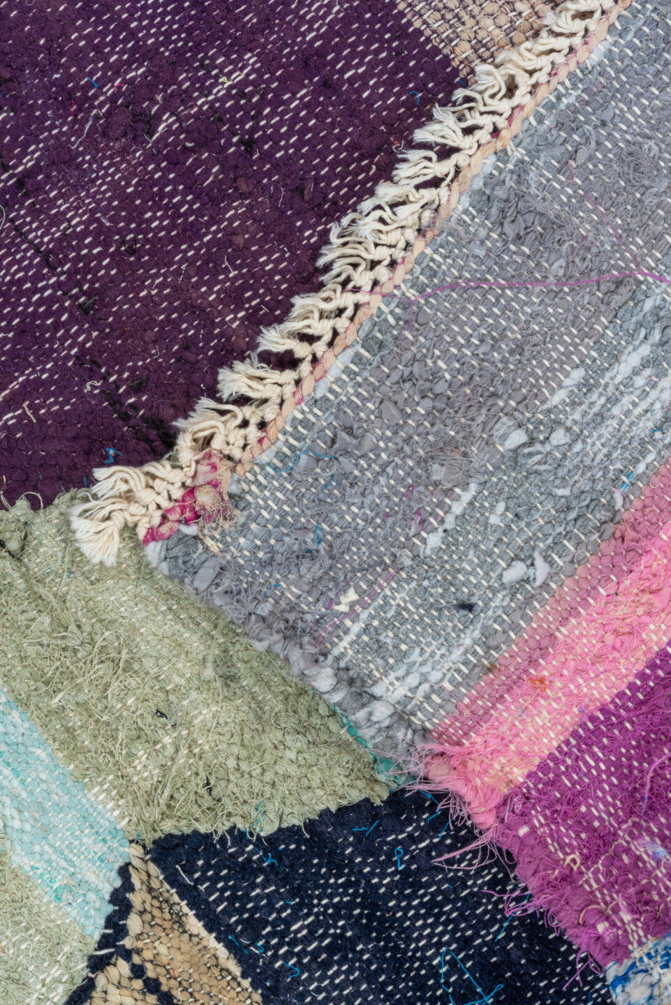 4' x 8' one-of-a-kind handmade vintage Rag Rug rug. Color palette: ivory, turquoise, navy, coral, plum, pink, orange, gray