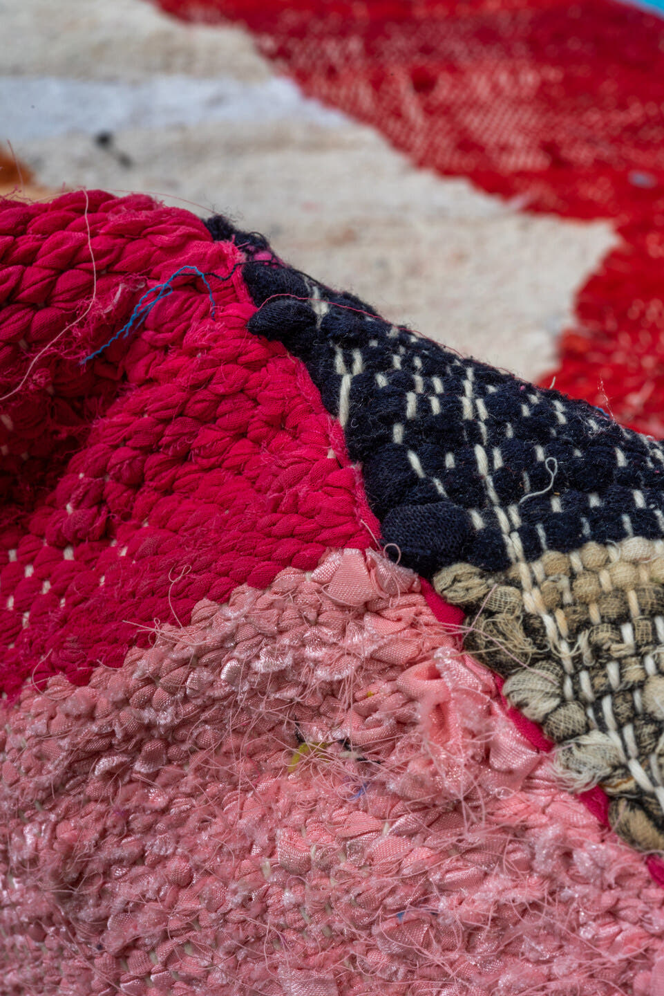 4' x 8' one-of-a-kind handmade vintage Rag Rug rug. Color palette: ivory, turquoise, navy, coral, plum, pink, orange, gray