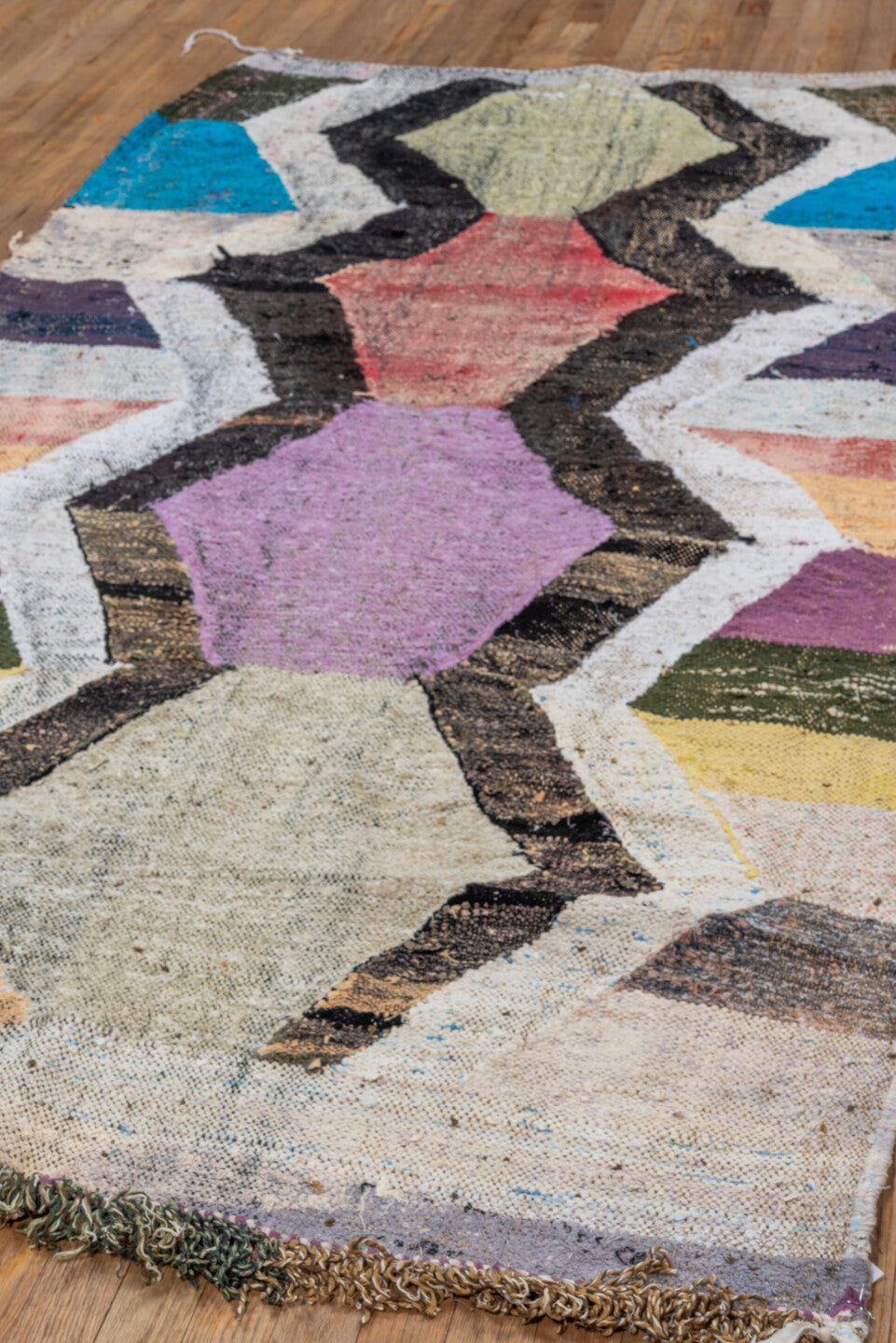 4' x 8' one-of-a-kind handmade vintage Rag Rug rug. Color palette: ivory, black, lavender, turquoise, blush, olive, ochre