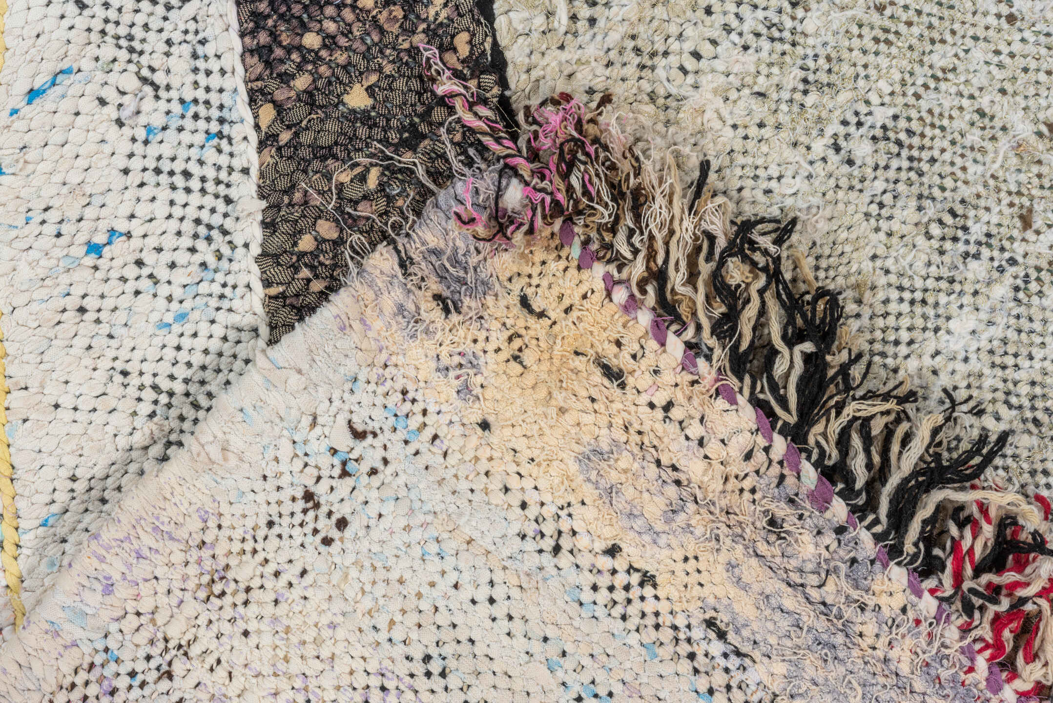 4' x 8' one-of-a-kind handmade vintage Rag Rug rug. Color palette: ivory, black, lavender, turquoise, blush, olive, ochre