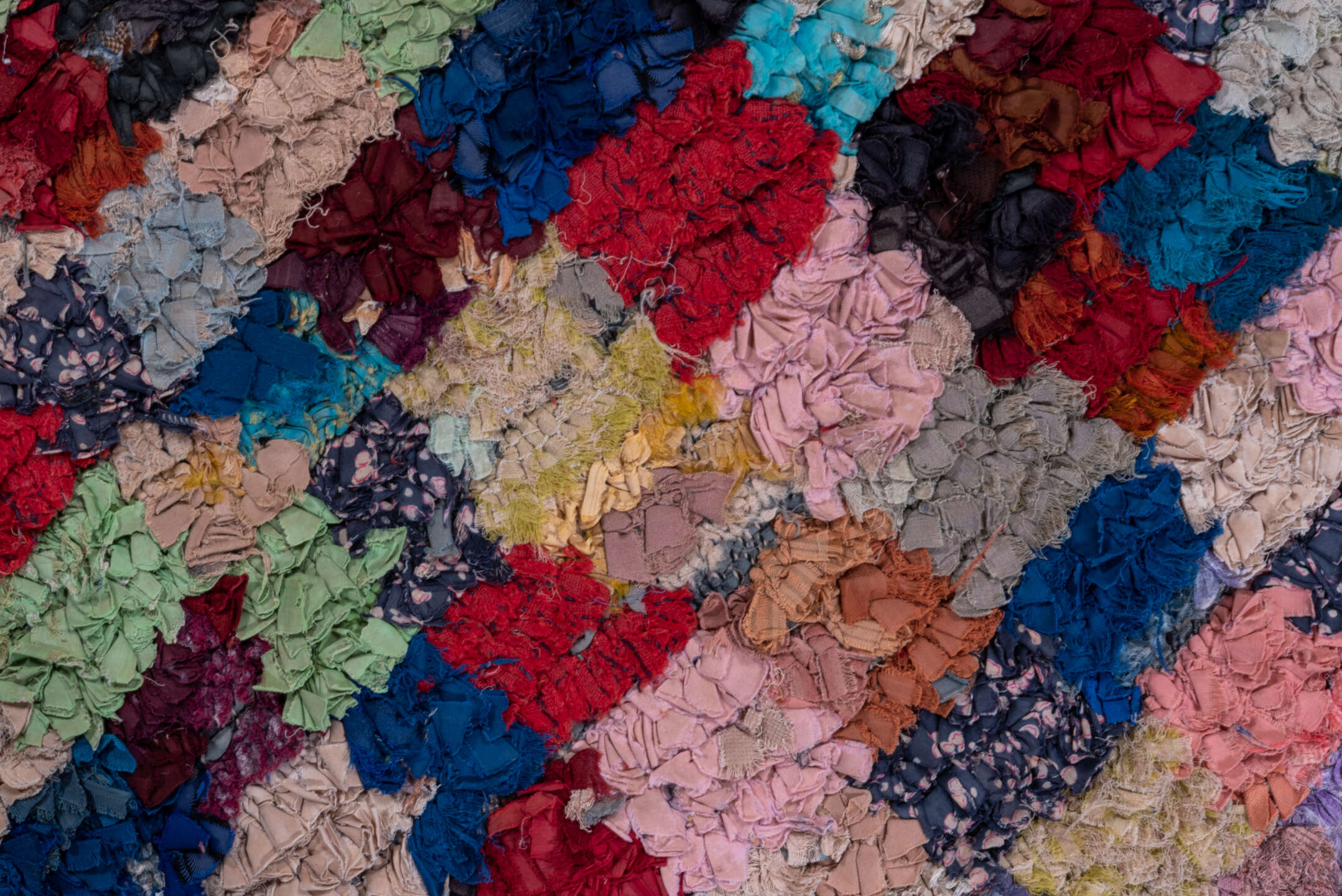 4' x 6' one-of-a-kind handmade vintage Rag Rug small size rug. Color palette: black, blue, brown, cadet blue, fire brick