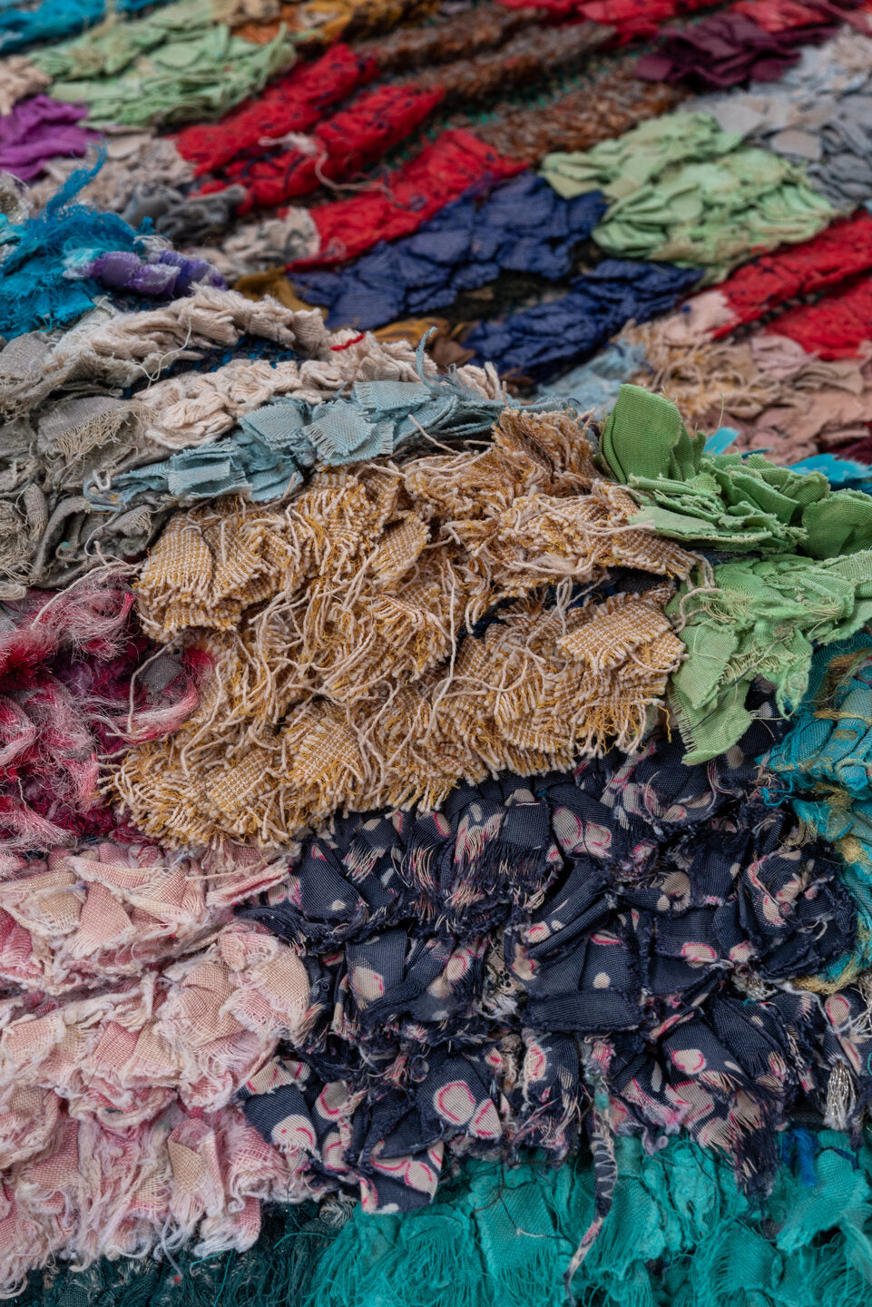 4' x 6' one-of-a-kind handmade vintage Rag Rug small size rug. Color palette: black, blue, brown, cadet blue, fire brick