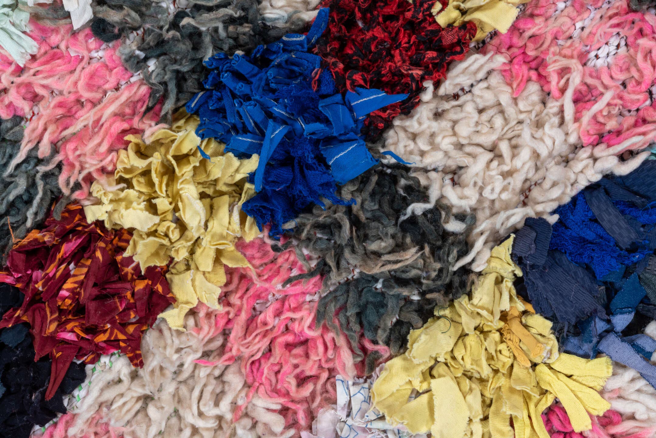 3' x 5' one-of-a-kind handmade vintage Rag Rug small size rug. Color palette: ivory, blush, cobalt, charcoal, crimson