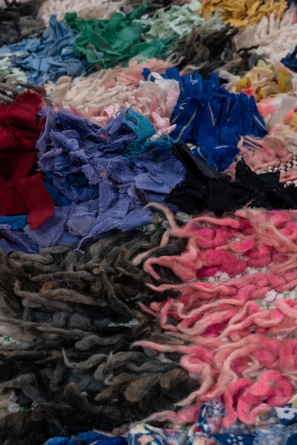 3' x 5' one-of-a-kind handmade vintage Rag Rug small size rug. Color palette: ivory, blush, cobalt, charcoal, crimson