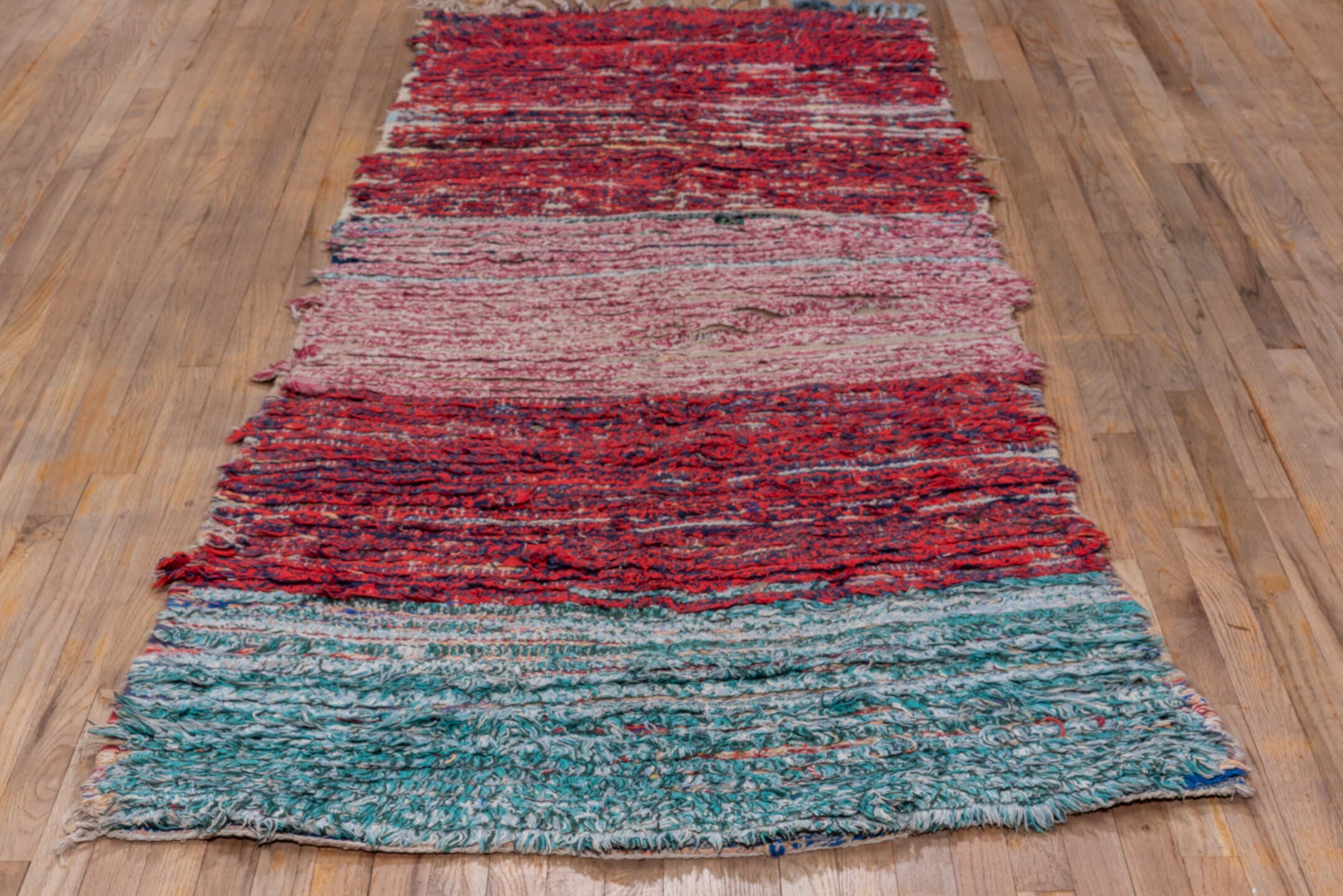 3' x 8' one-of-a-kind handmade vintage Rag Rug runner rug. Color palette: crimson, ivory, red, aqua, navy, rose, teal, blue