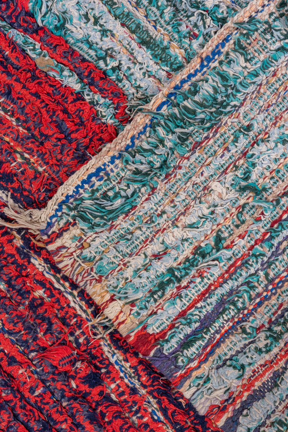 3' x 8' one-of-a-kind handmade vintage Rag Rug runner rug. Color palette: crimson, ivory, red, aqua, navy, rose, teal, blue