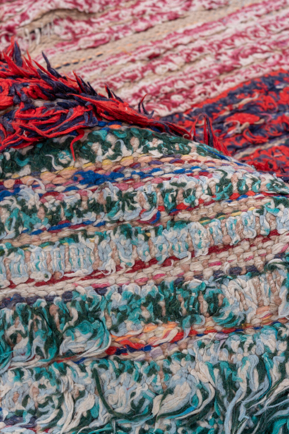 3' x 8' one-of-a-kind handmade vintage Rag Rug runner rug. Color palette: crimson, ivory, red, aqua, navy, rose, teal, blue