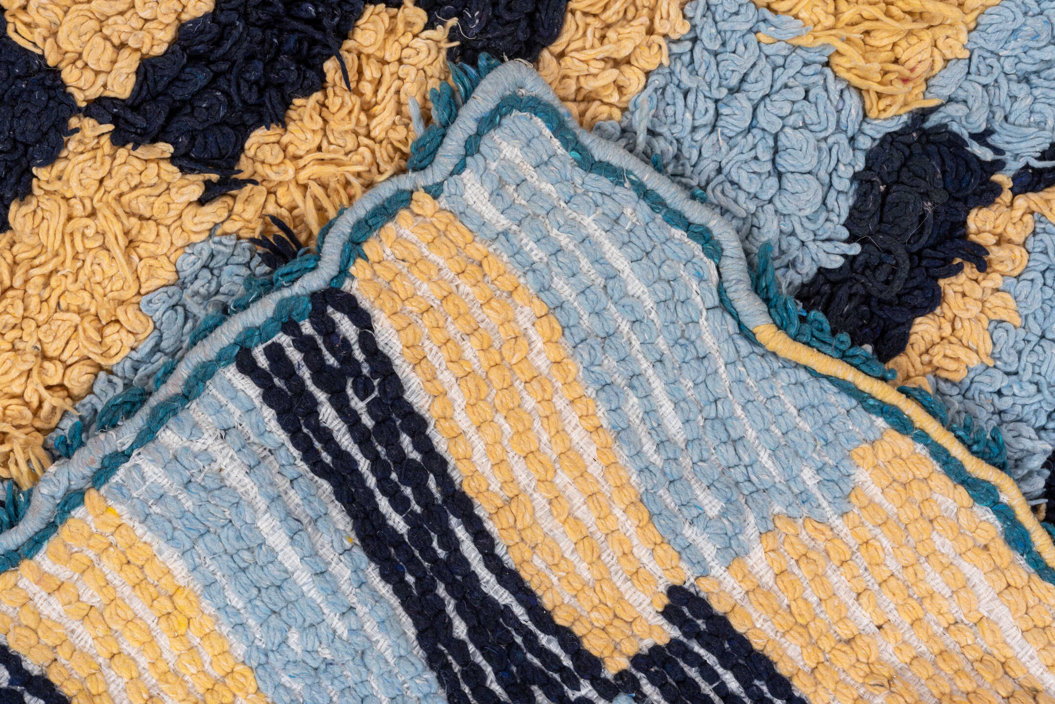 3' x 6' one-of-a-kind handmade vintage Rag Rug runner rug. Color palette: light blue, cream, navy, teal, rust, black, ivory