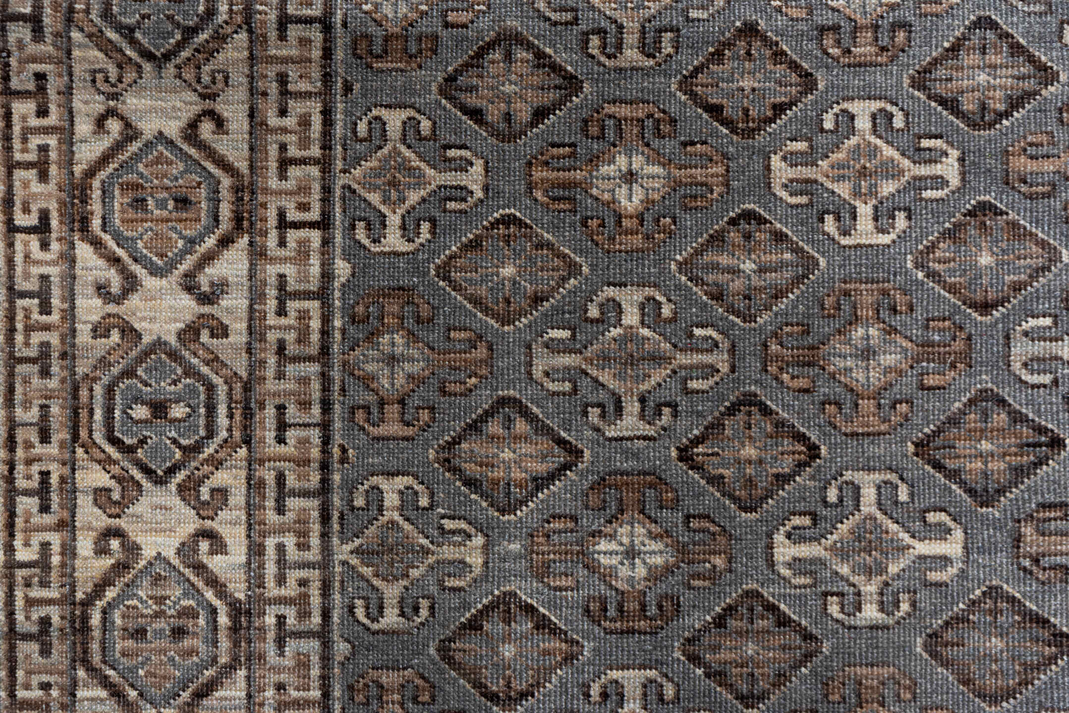 4' x 6' one-of-a-kind handmade vintage Khotan small size rug. Color palette: brown, dark gray, gray, light gray, off-white