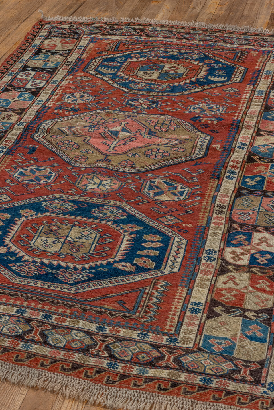 3' x 6' one-of-a-kind handmade antique Sumak small size rug. Color palette: rust, ivory, indigo, camel, charcoal, rose