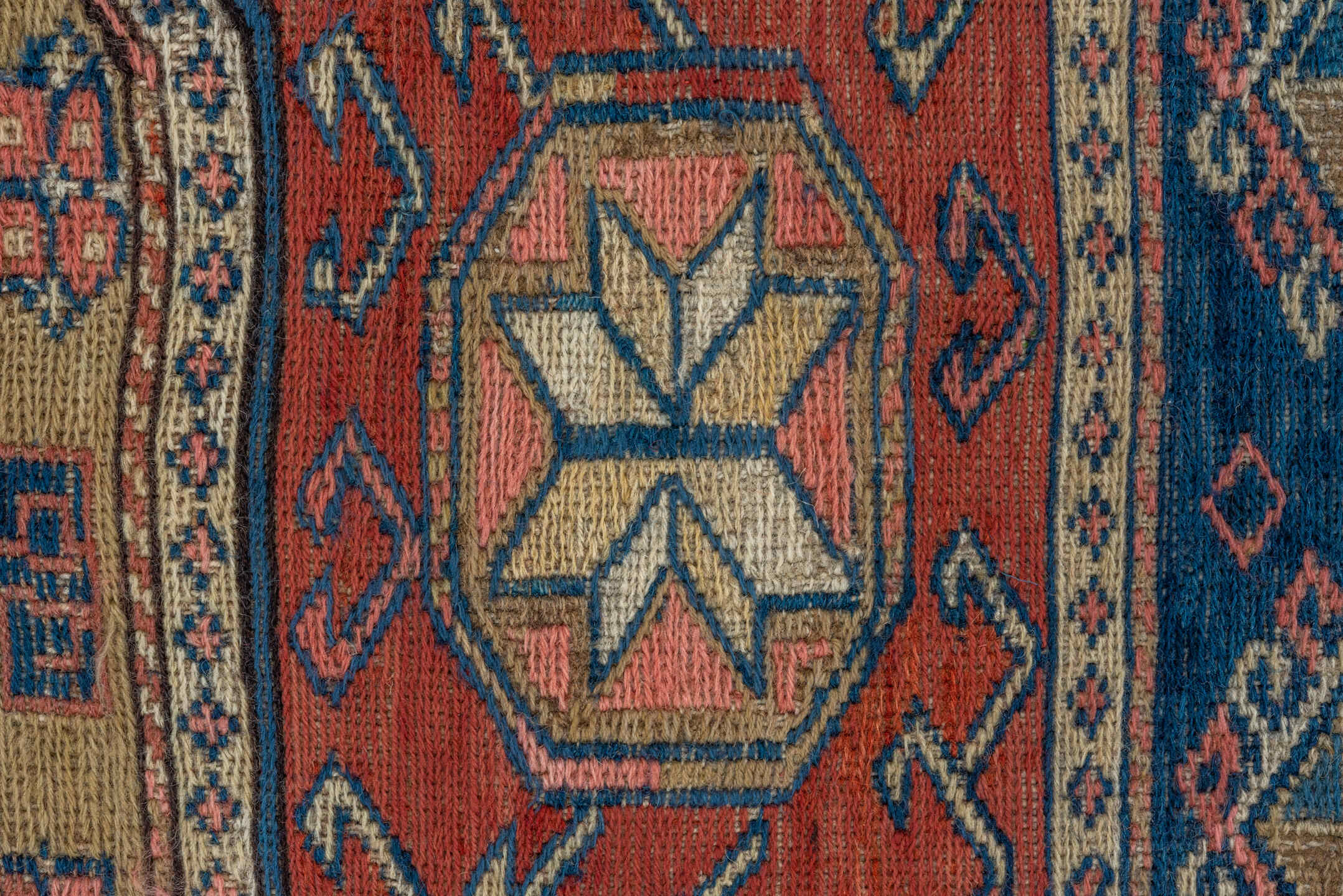 3' x 6' one-of-a-kind handmade antique Sumak small size rug. Color palette: rust, ivory, indigo, camel, charcoal, rose