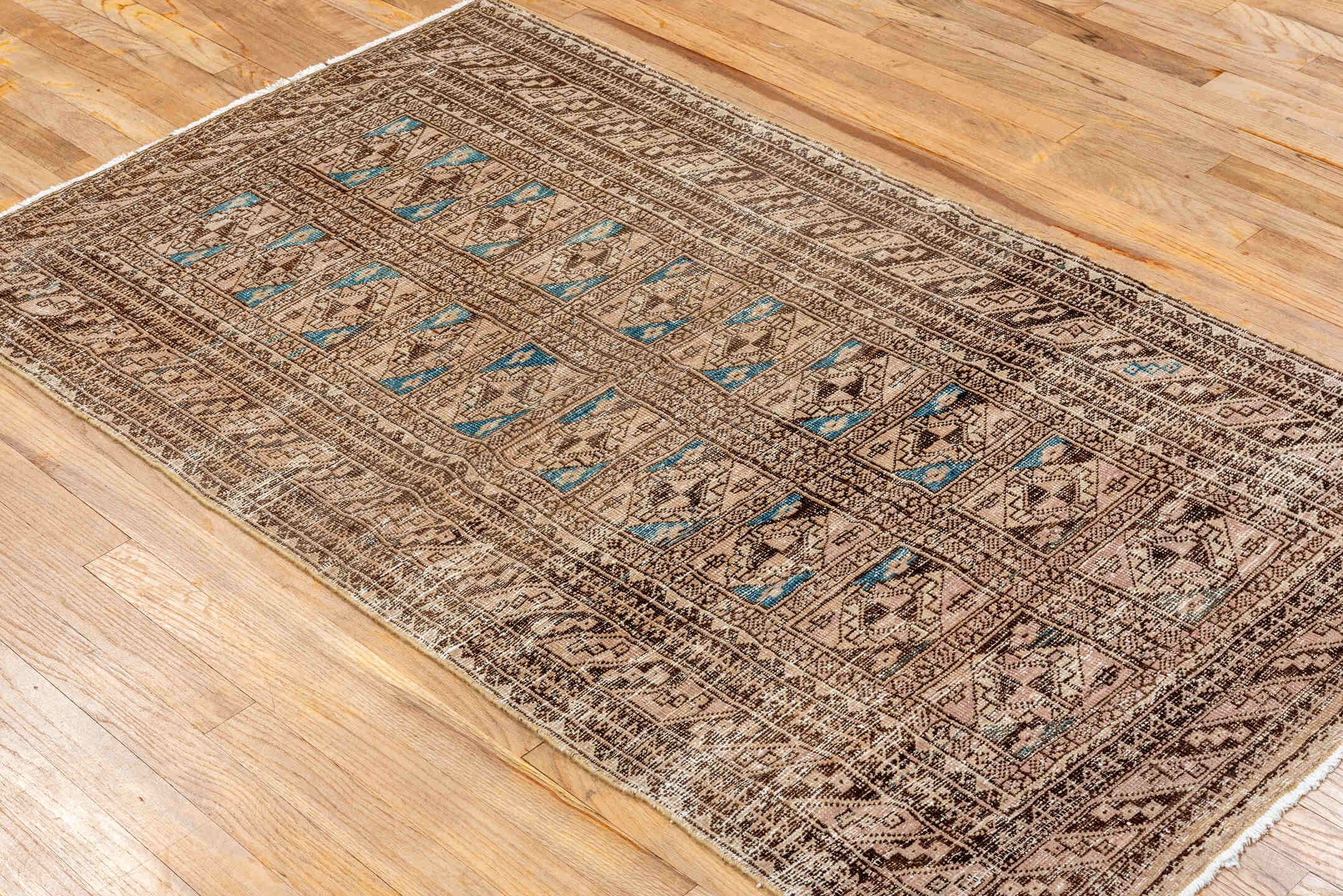 3' x 5' one-of-a-kind handmade antique Belouch small size rug. Color palette: camel, ivory, brown, sky_blue, taupe, beige
