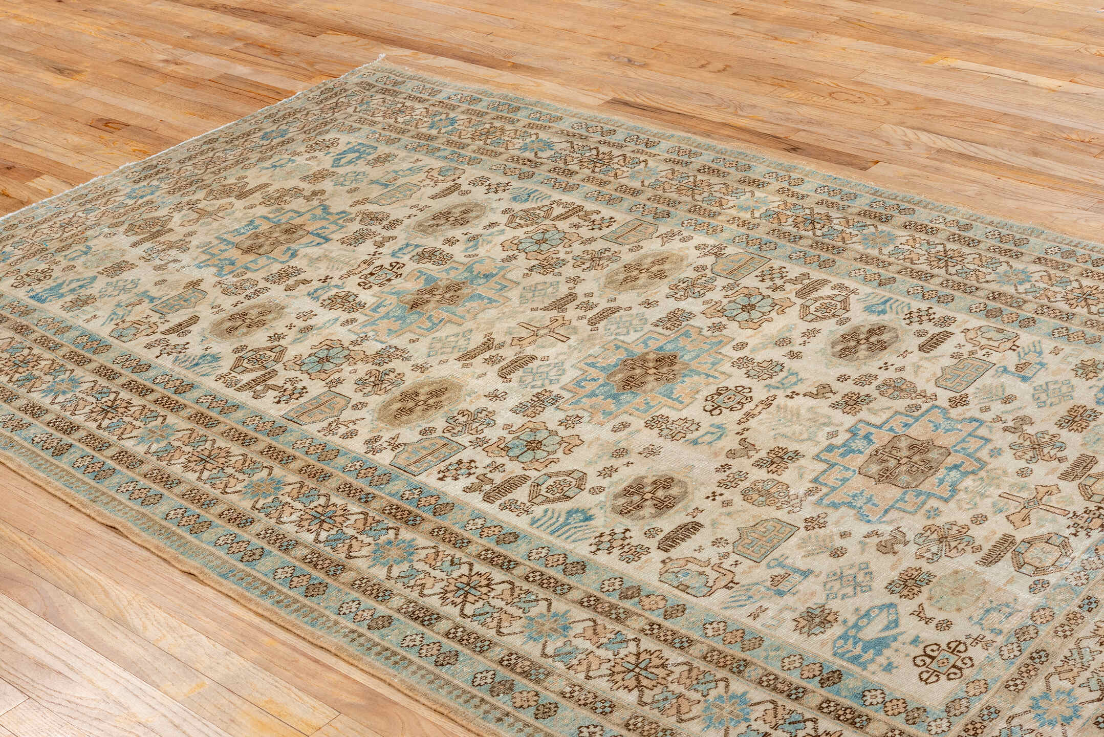 5' x 8' one-of-a-kind handmade antique Ardebil medium size rug. Color palette: ivory, sky blue, taupe, camel, brown, beige