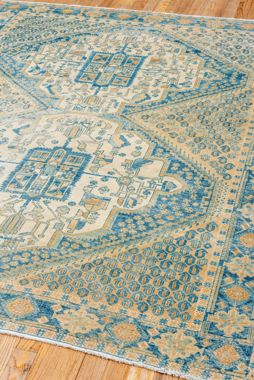 5' x 6' one-of-a-kind handmade antique Afshar rug. Color palette: ivory, sky blue, sand, camel, beige, light blue