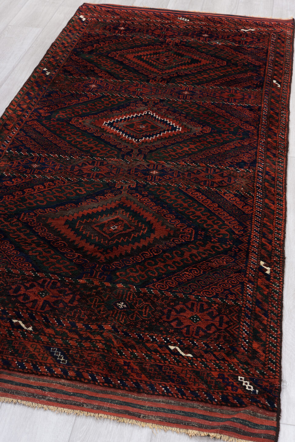 3' x 8' one-of-a-kind handmade vintage Belouch runner rug. Color palette: crimson, black, burgundy, ivory, charcoal, red