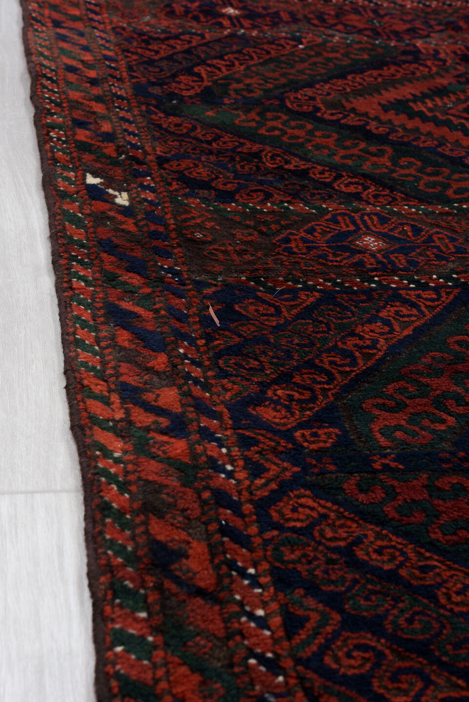 3' x 8' one-of-a-kind handmade vintage Belouch runner rug. Color palette: crimson, black, burgundy, ivory, charcoal, red
