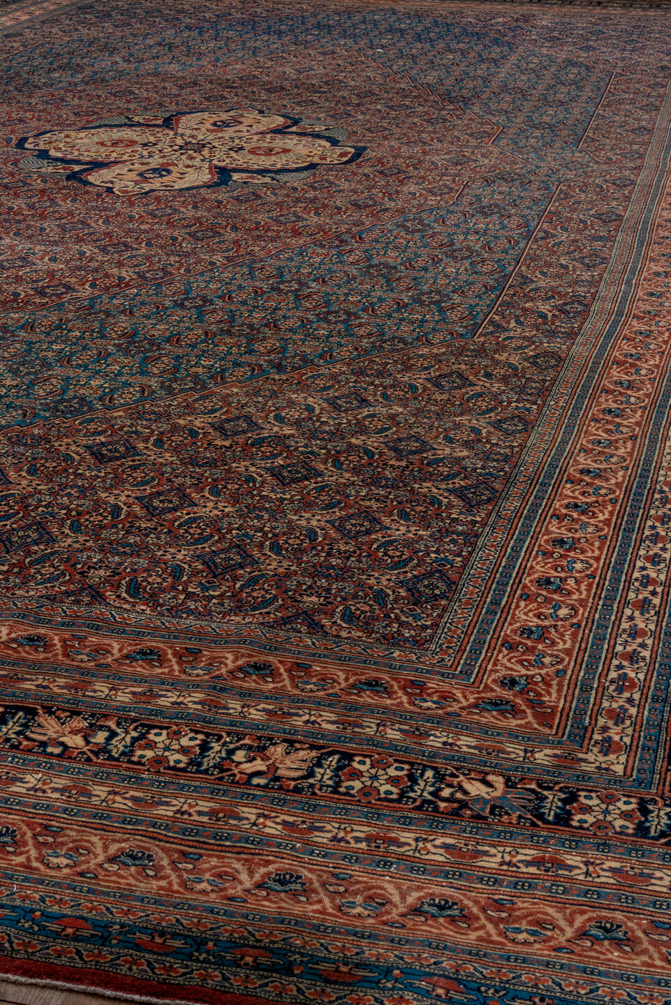 12' x 19' one-of-a-kind handmade antique Tabriz oversize rug. Color palette: navy, rust, ivory, terra cotta, indigo, camel